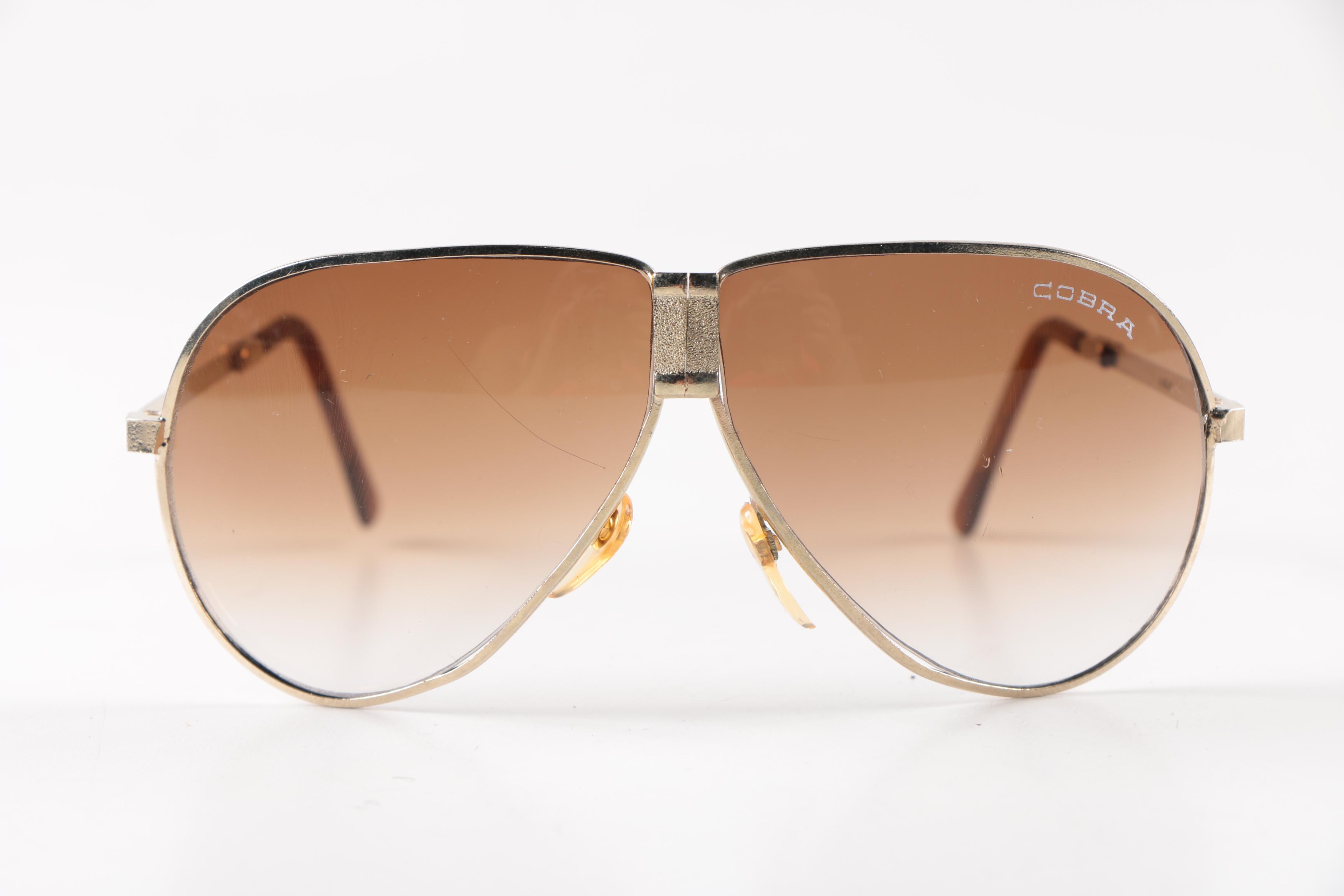 Collection of Foldable Sunglasses and Cases by Cobra and Ferrari