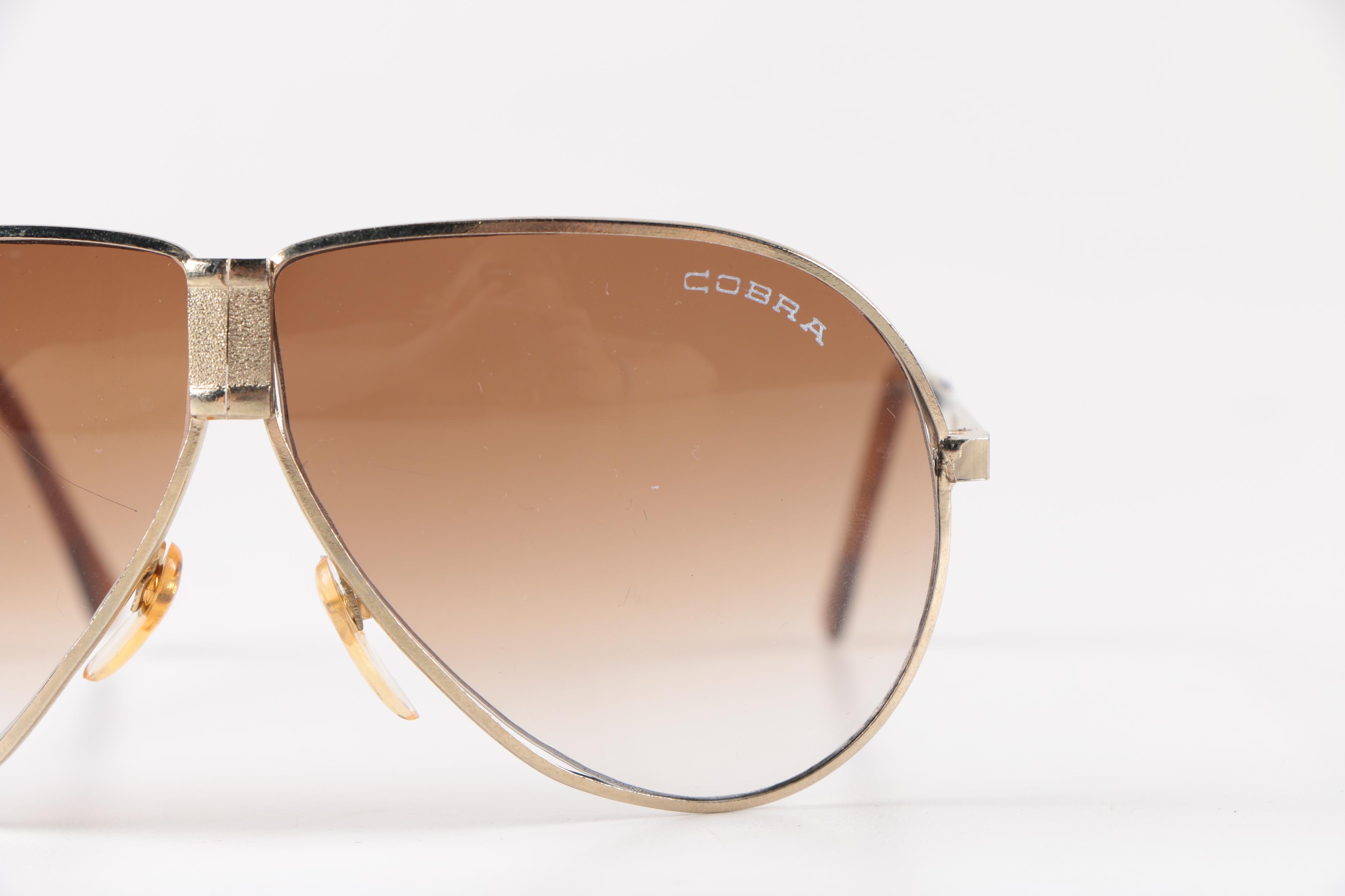 Collection of Foldable Sunglasses and Cases by Cobra and Ferrari