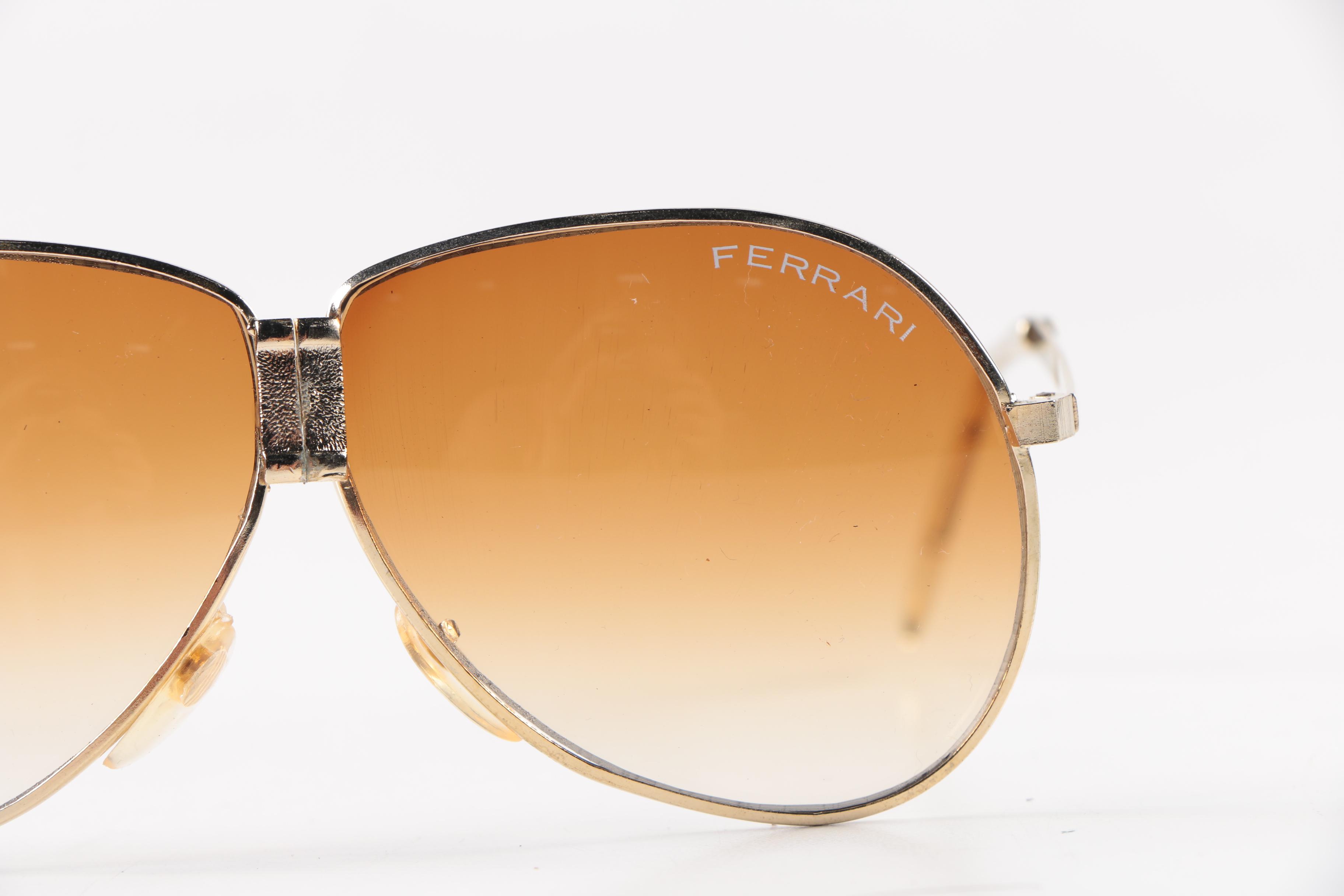Collection of Foldable Sunglasses and Cases by Cobra and Ferrari