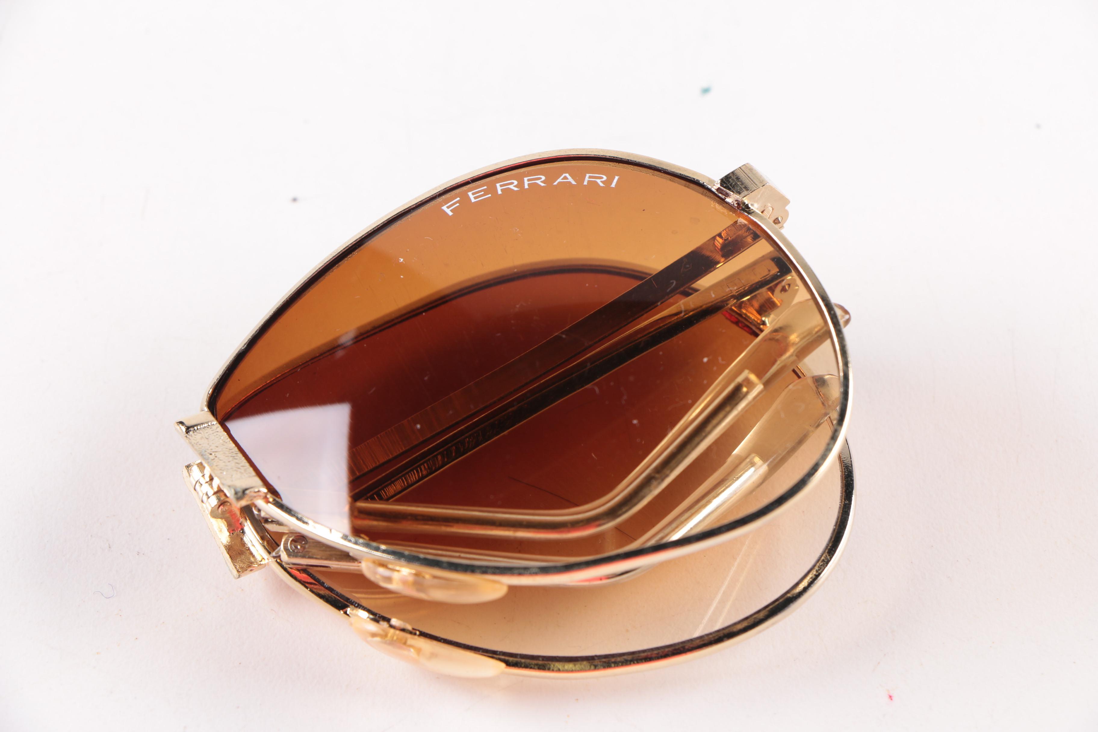 Collection of Foldable Sunglasses and Cases by Cobra and Ferrari