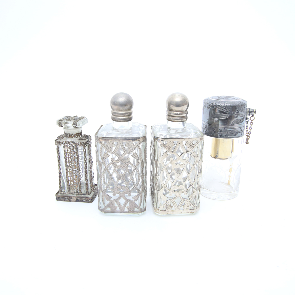 Assortment of Vintage Perfume Bottles featuring Metal Overlays