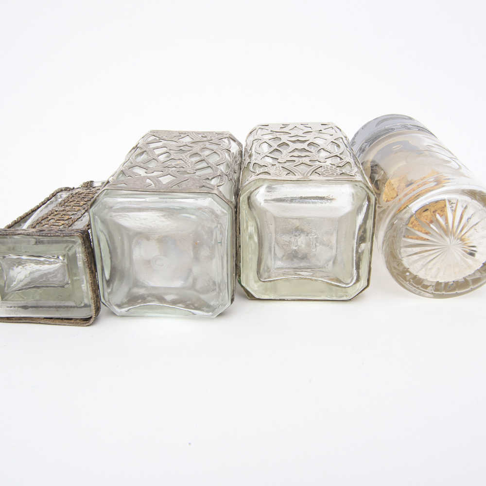 Assortment of Vintage Perfume Bottles featuring Metal Overlays