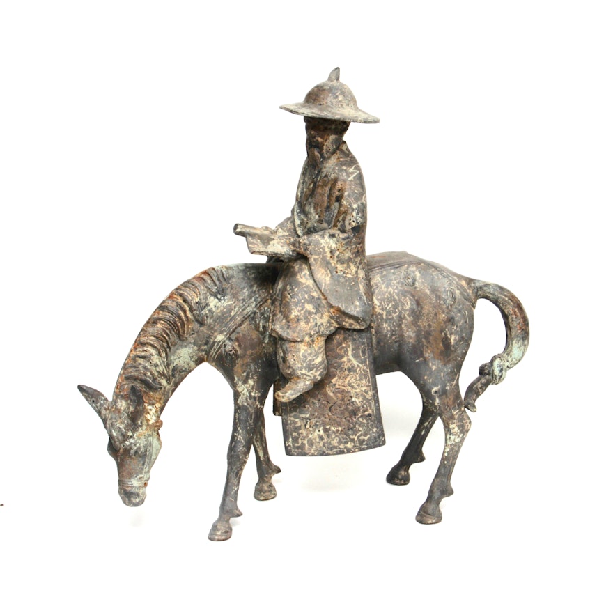 Iron Sculpture of Man Riding Horse