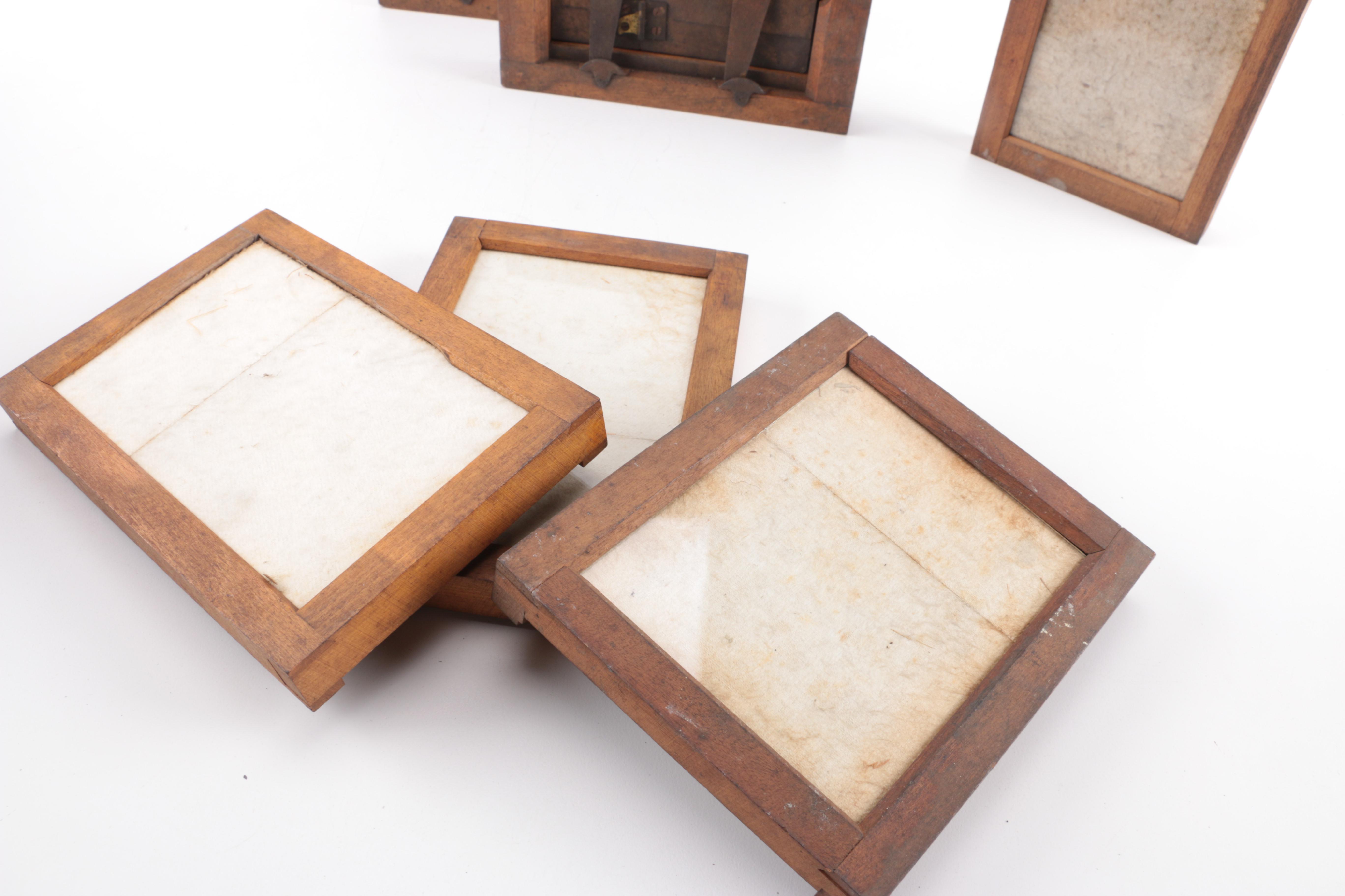 Collection of Antique Photographs and Wooden Printing Frames