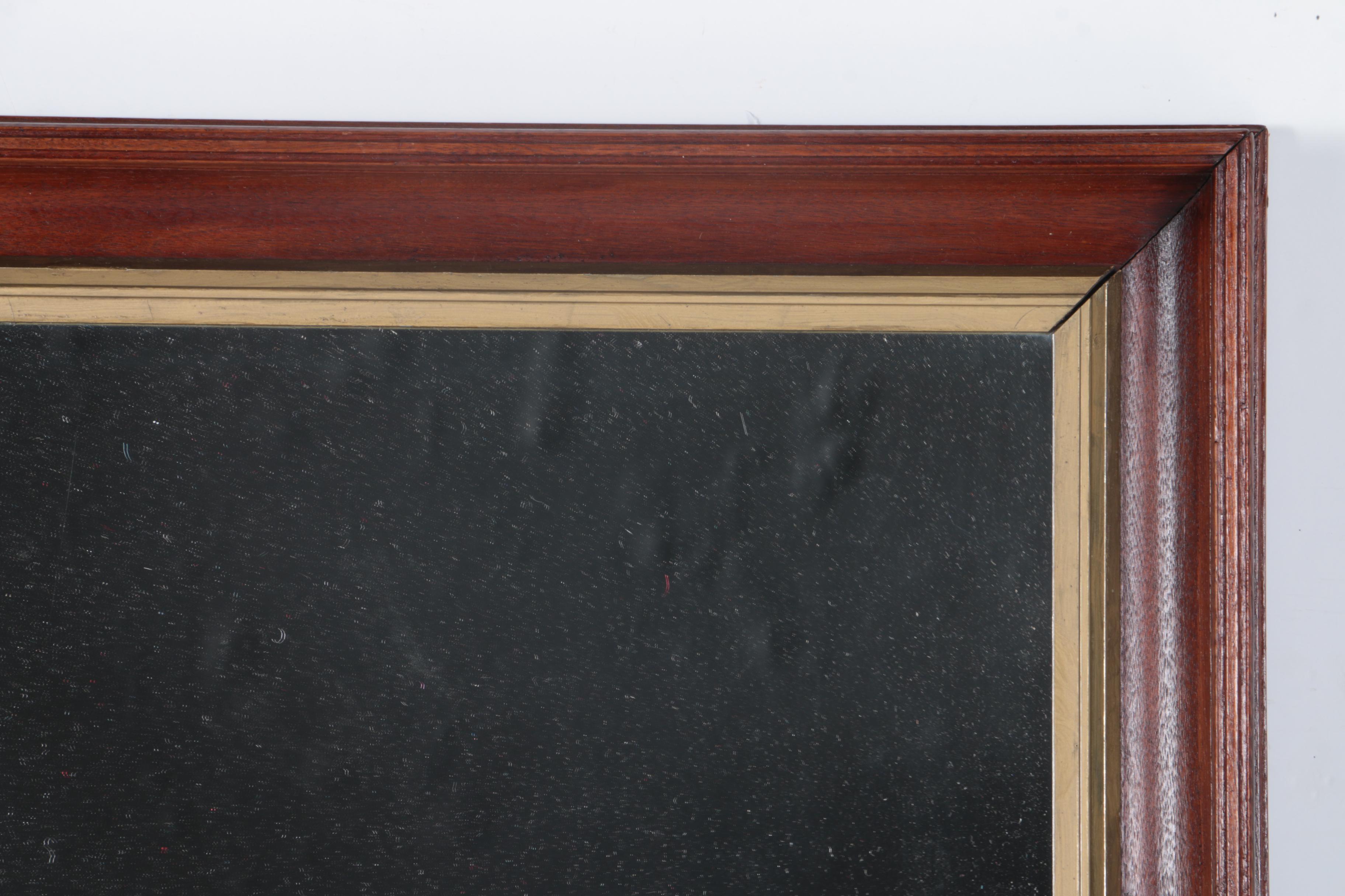 A Beveled Wood Framed Wall Mirror