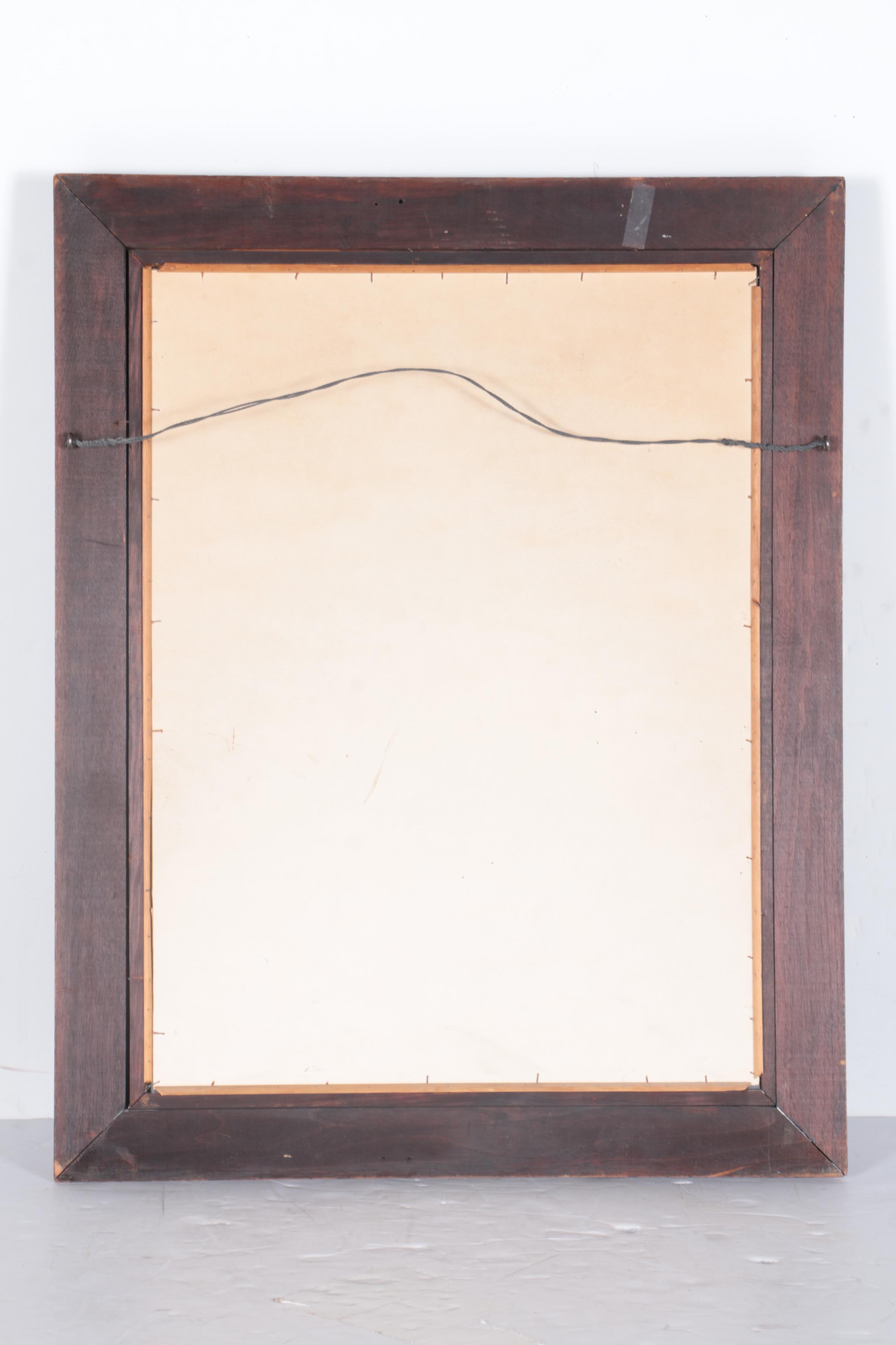 A Beveled Wood Framed Wall Mirror