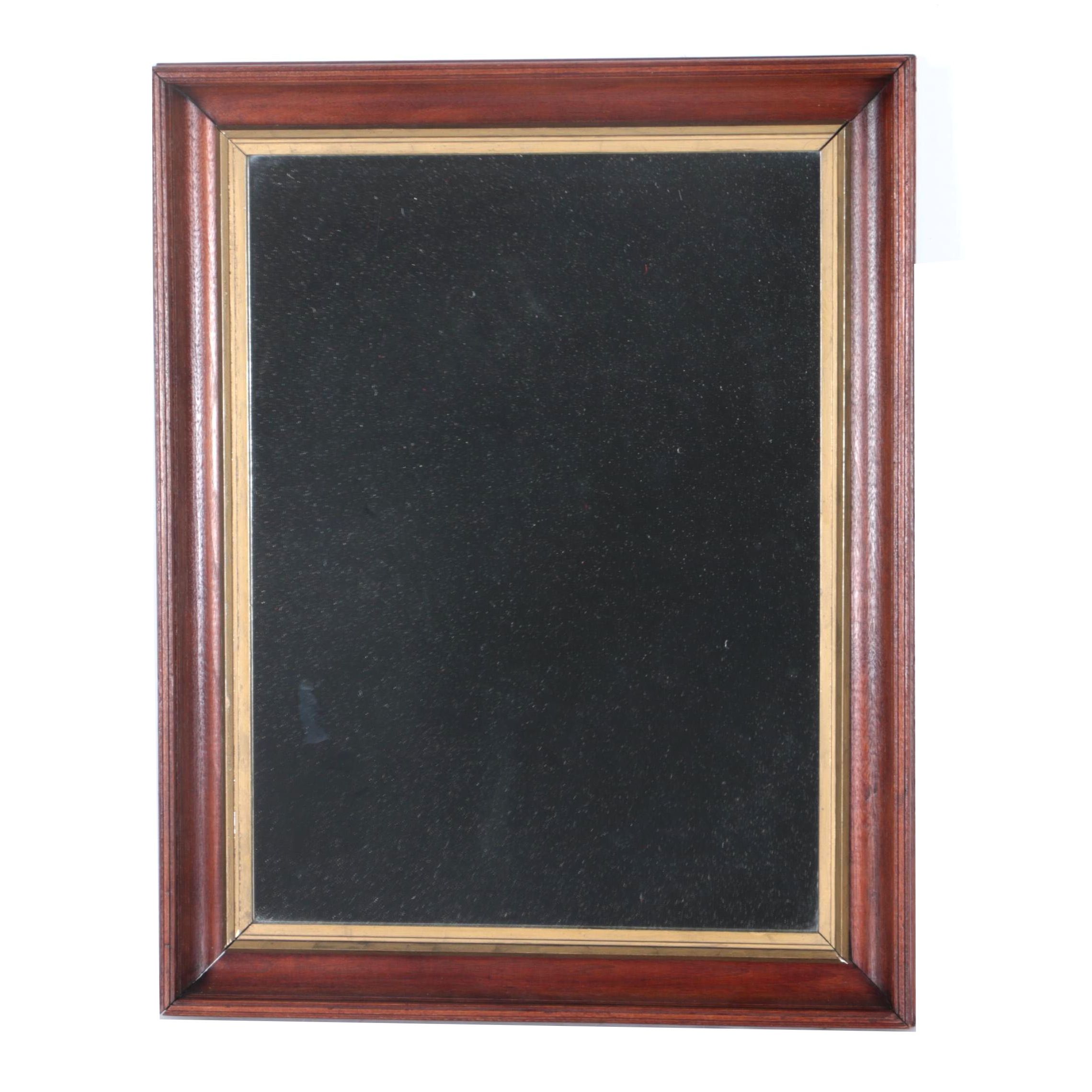 A Beveled Wood Framed Wall Mirror