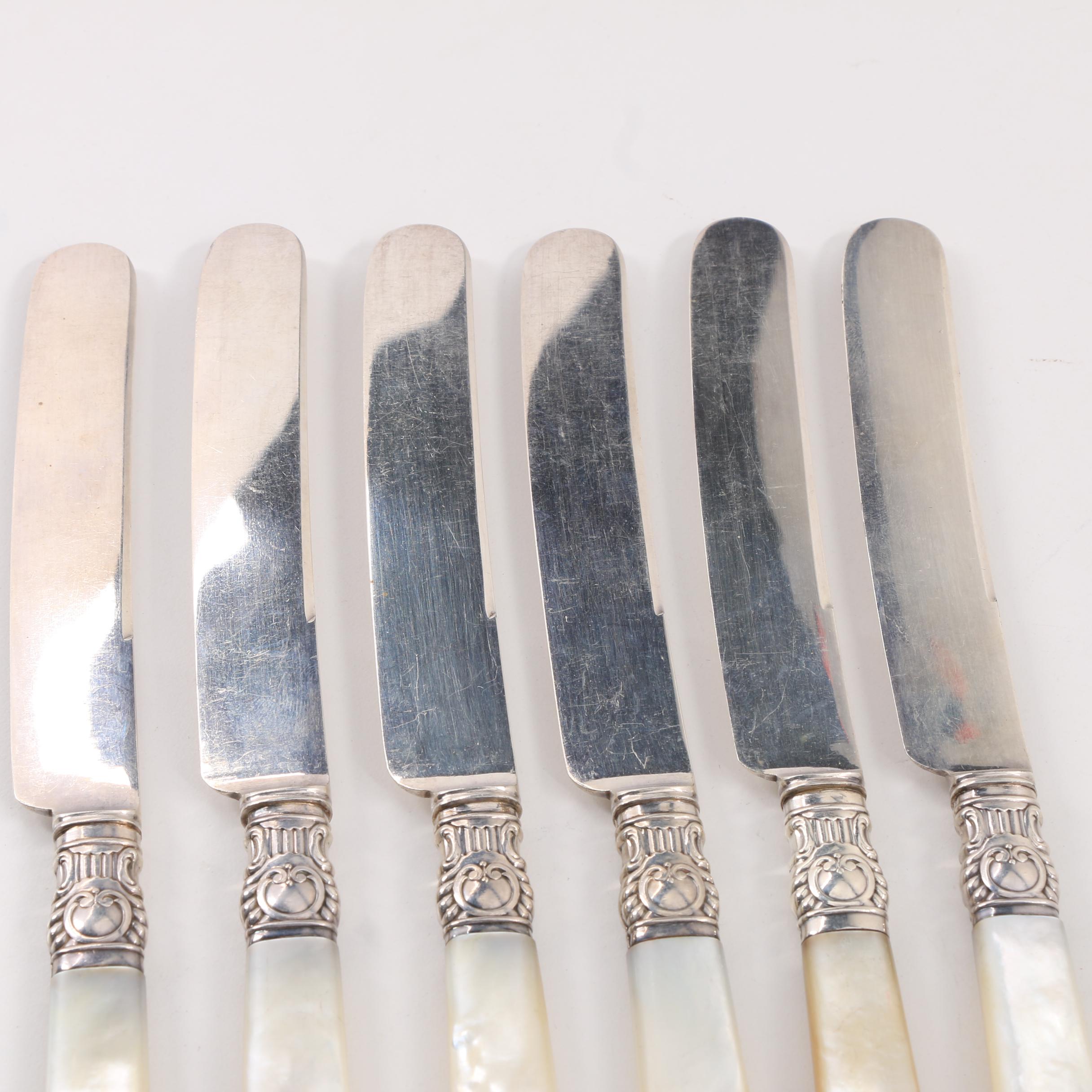 Six Mother of Pearl Handled Dessert Knives with Sterling Bolsters