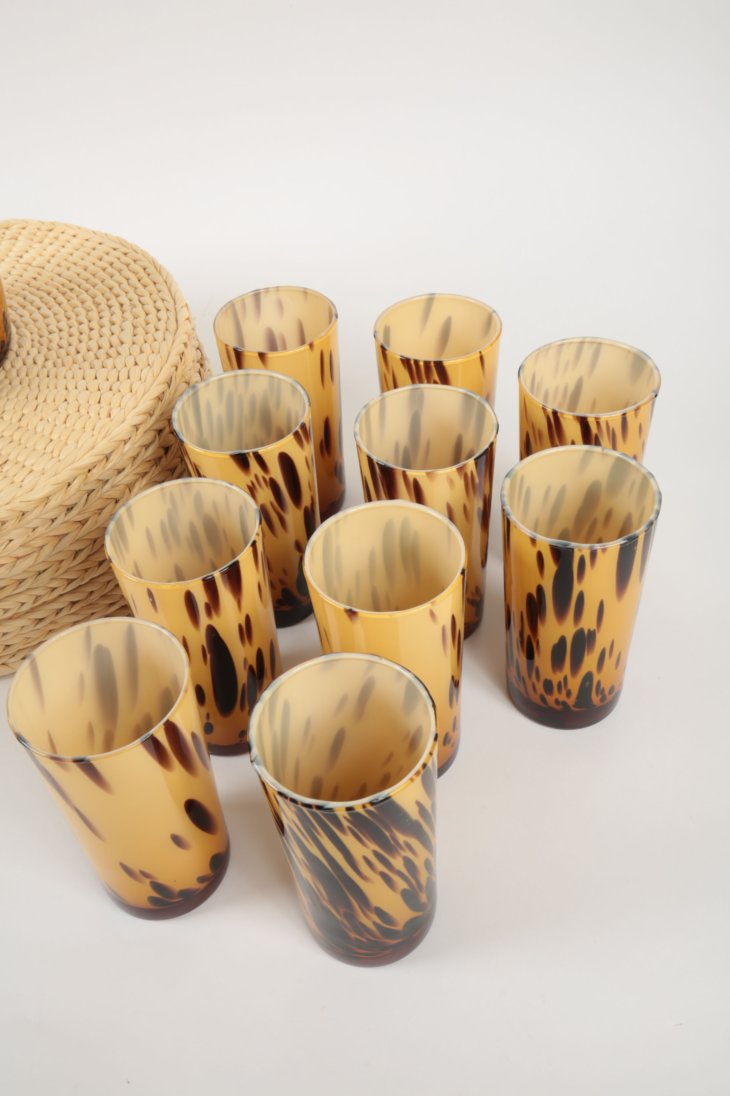 Handblown Tortoise Patterned Glass Barware and Woven Grass Table Mats