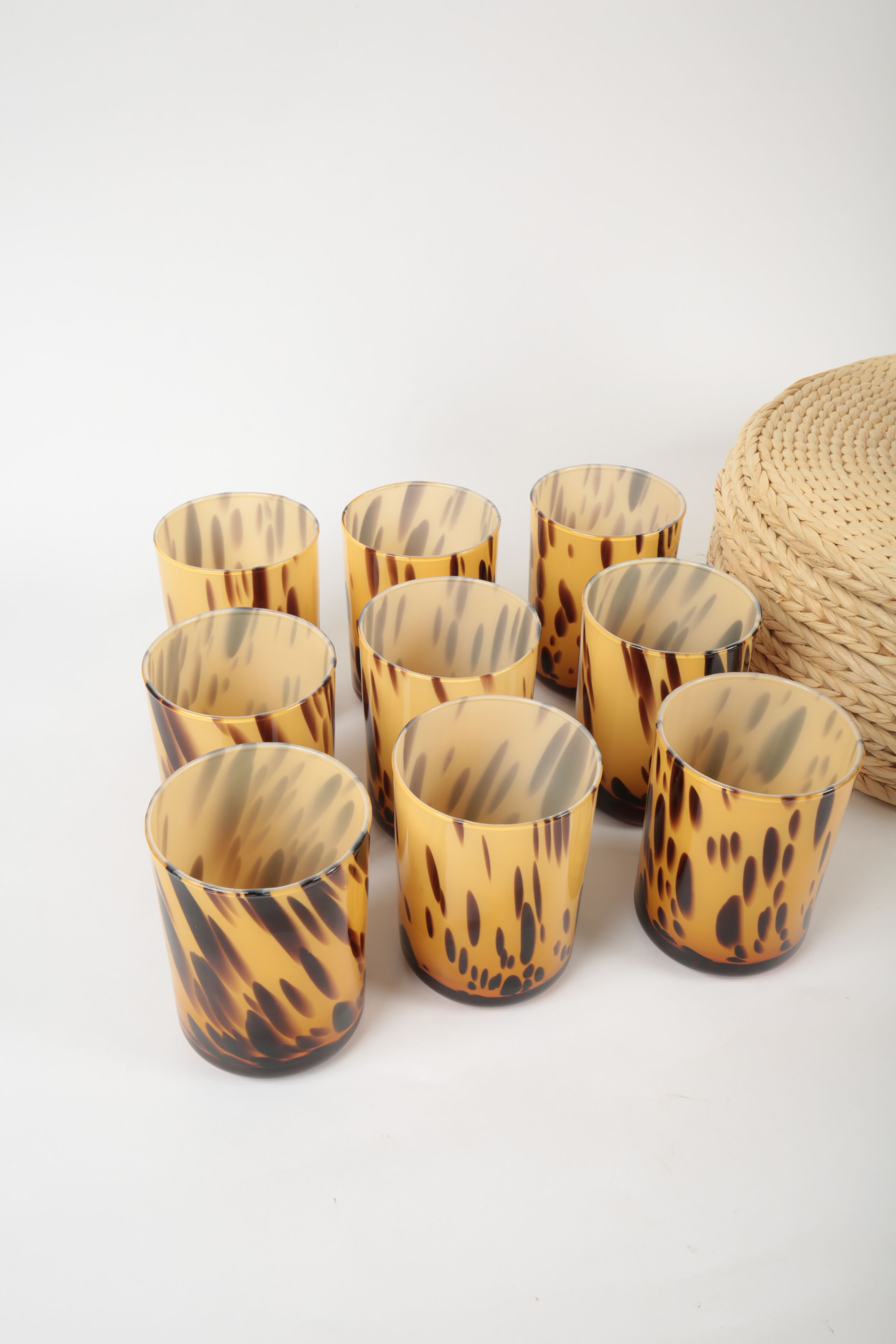 Handblown Tortoise Patterned Glass Barware and Woven Grass Table Mats