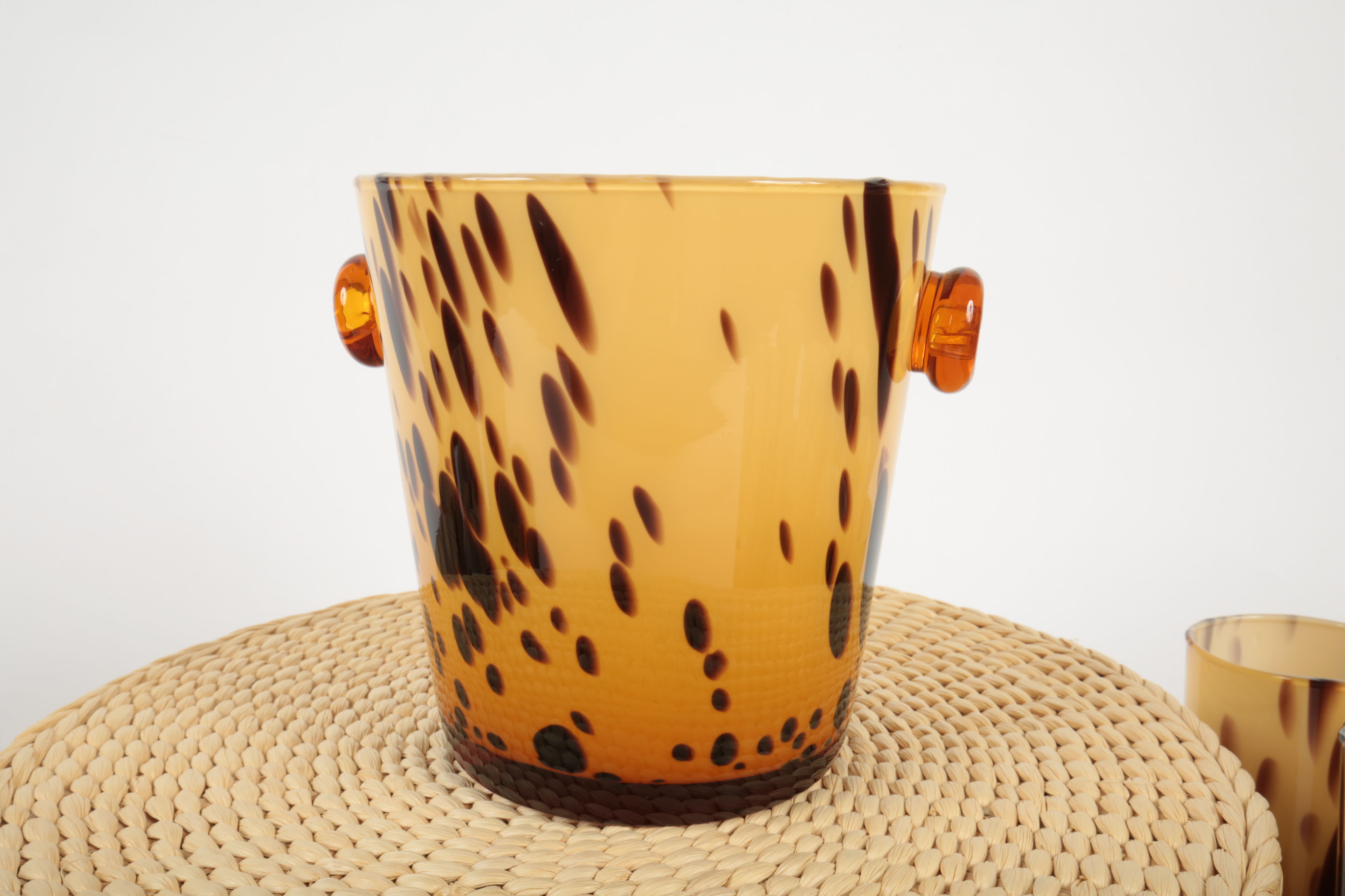 Handblown Tortoise Patterned Glass Barware and Woven Grass Table Mats