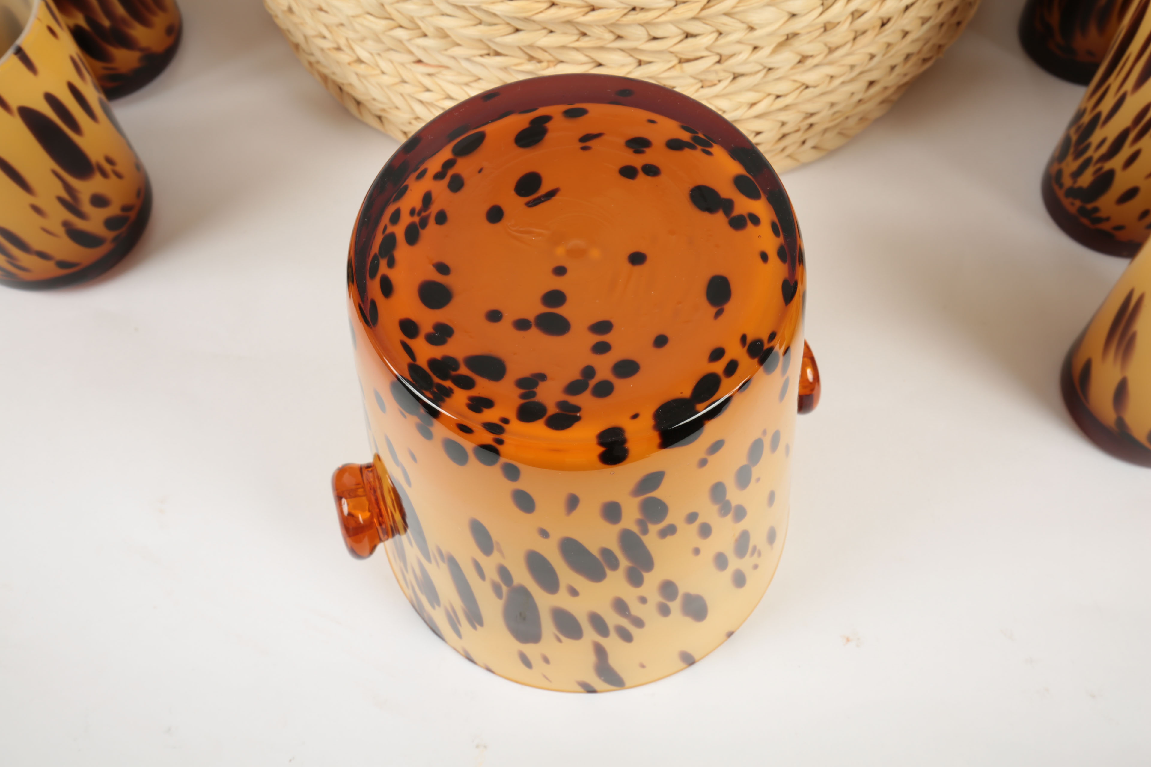 Handblown Tortoise Patterned Glass Barware and Woven Grass Table Mats