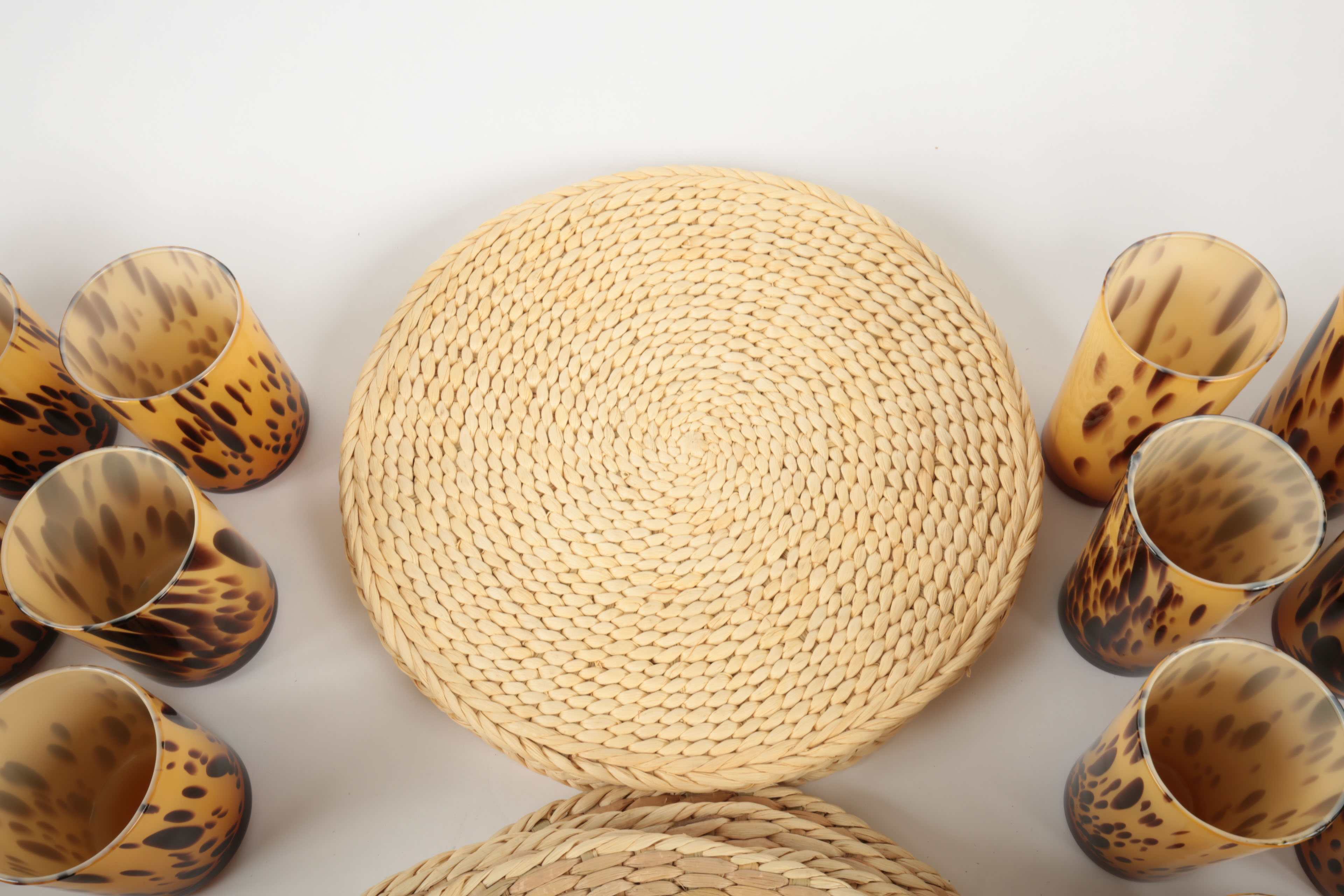Handblown Tortoise Patterned Glass Barware and Woven Grass Table Mats