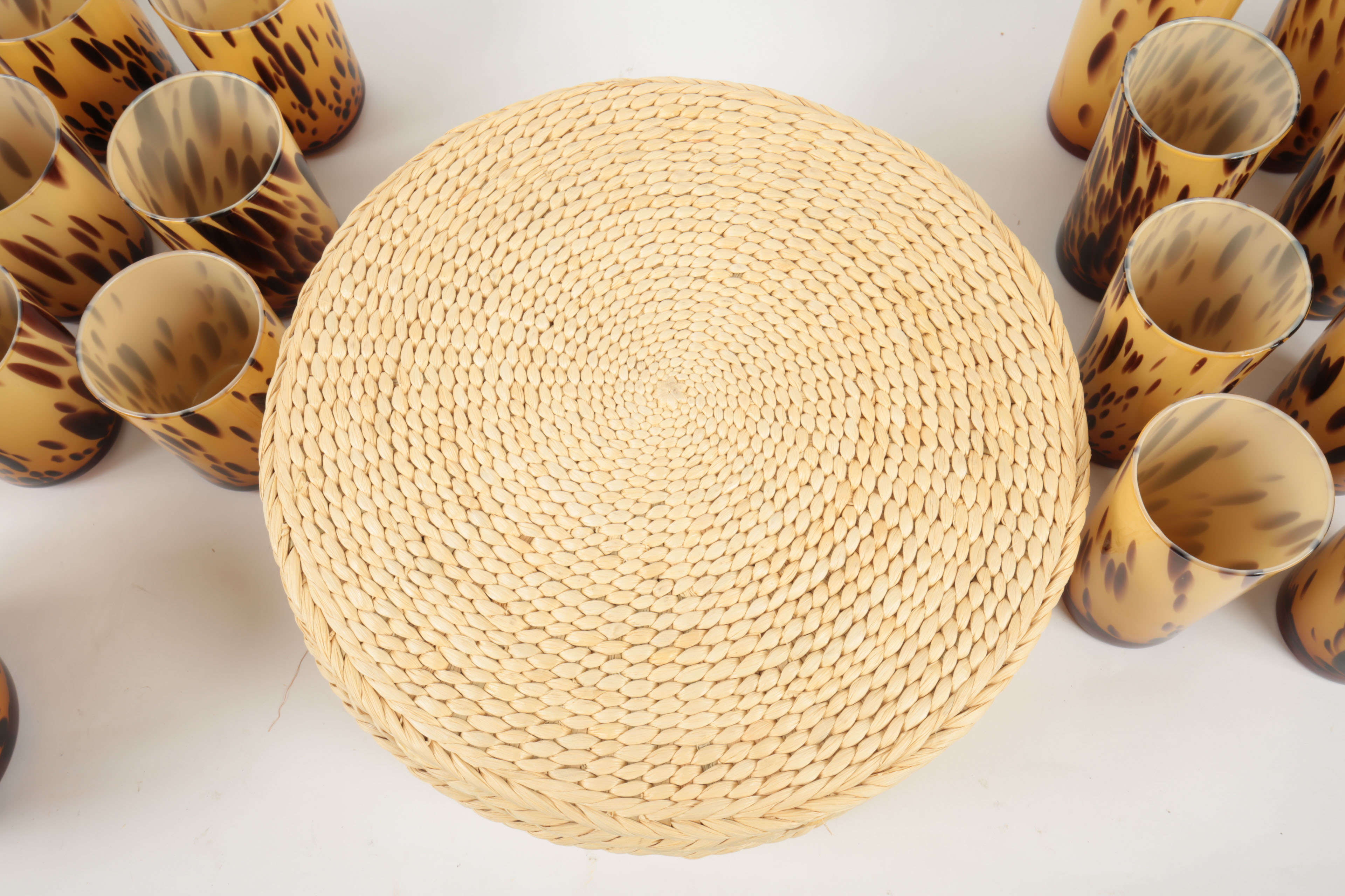 Handblown Tortoise Patterned Glass Barware and Woven Grass Table Mats