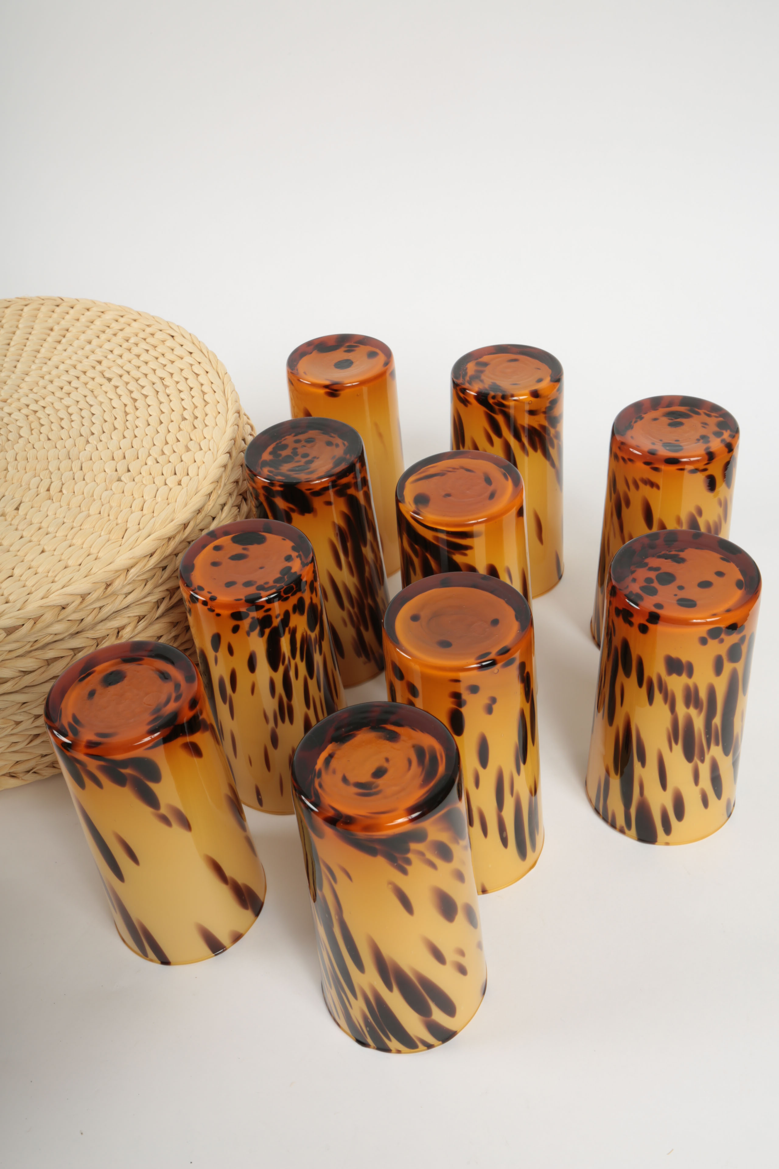 Handblown Tortoise Patterned Glass Barware and Woven Grass Table Mats