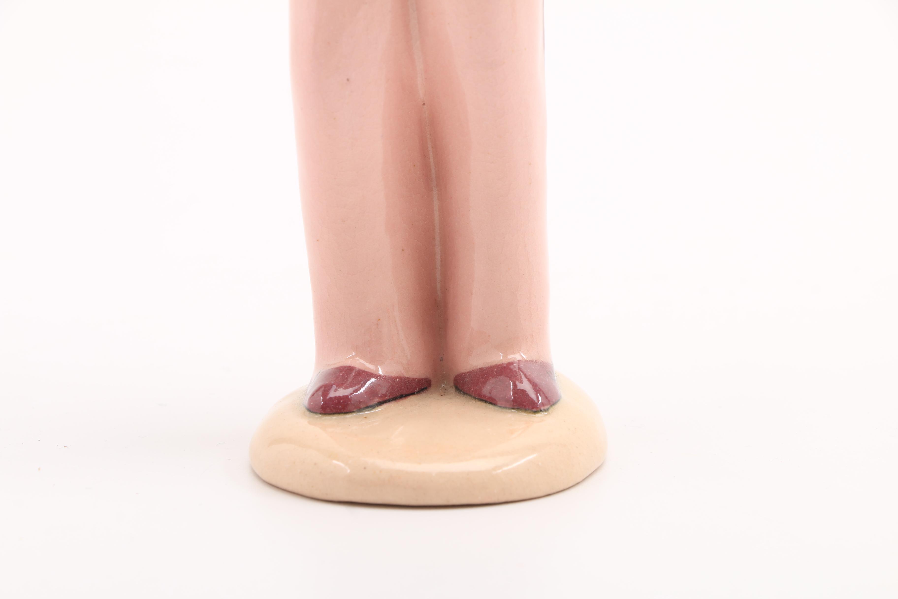 Assortment of Porcelain Figurines and a Vase