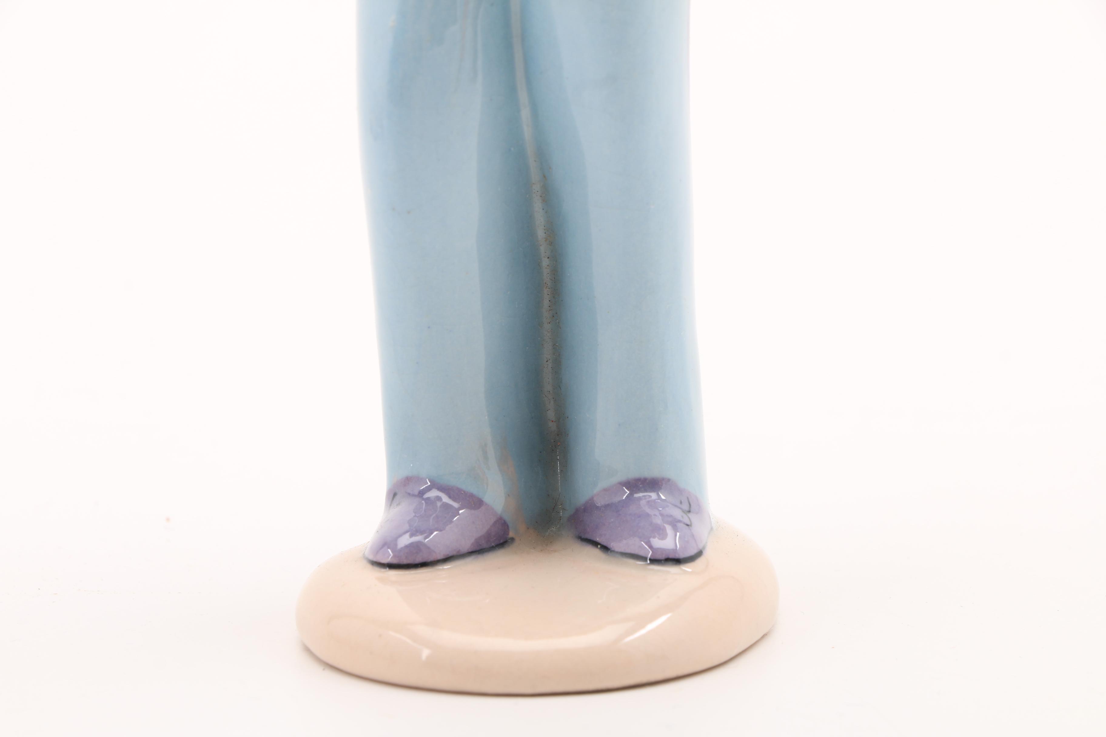 Assortment of Porcelain Figurines and a Vase