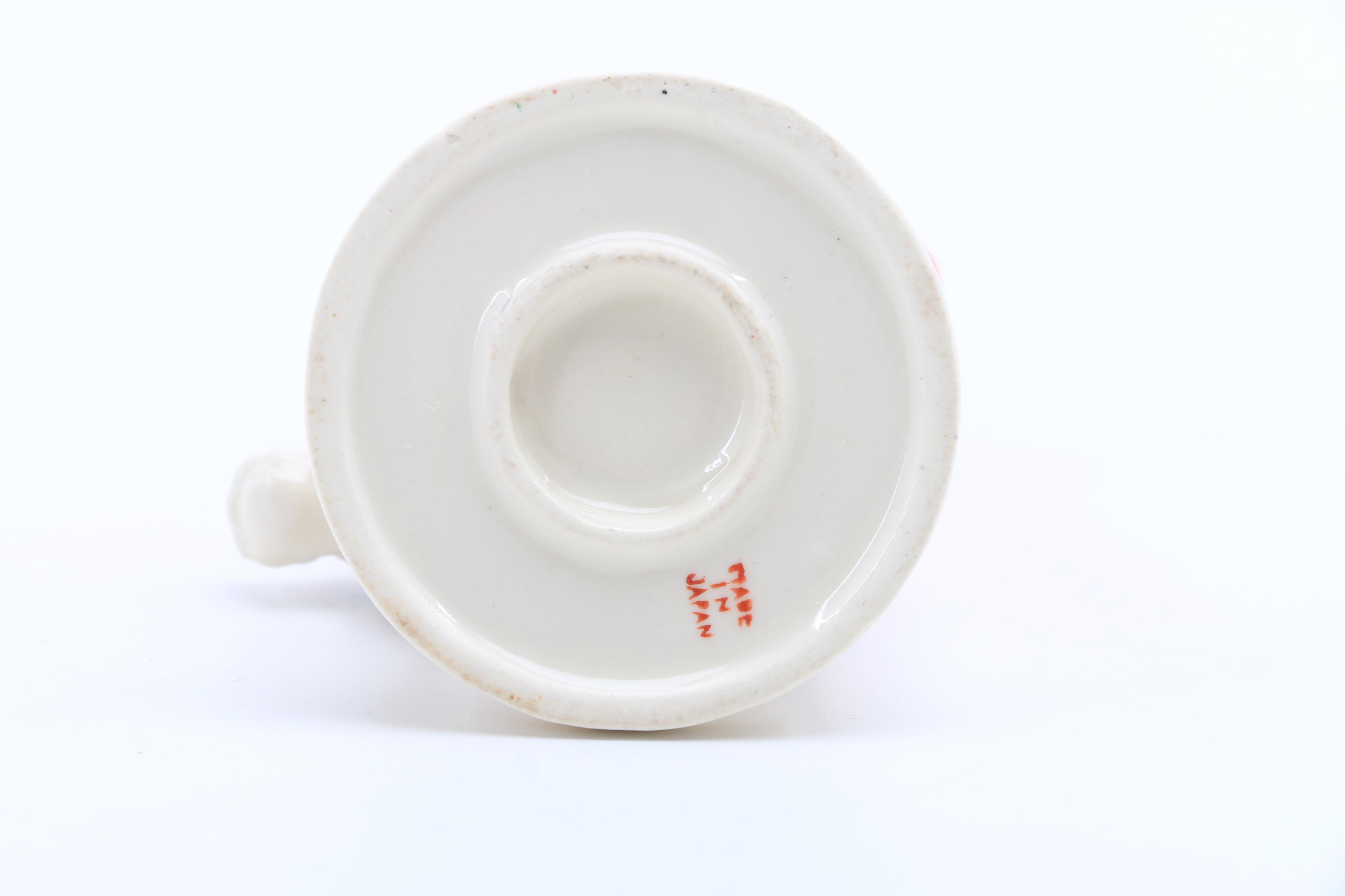 Assortment of Porcelain Figurines and a Vase