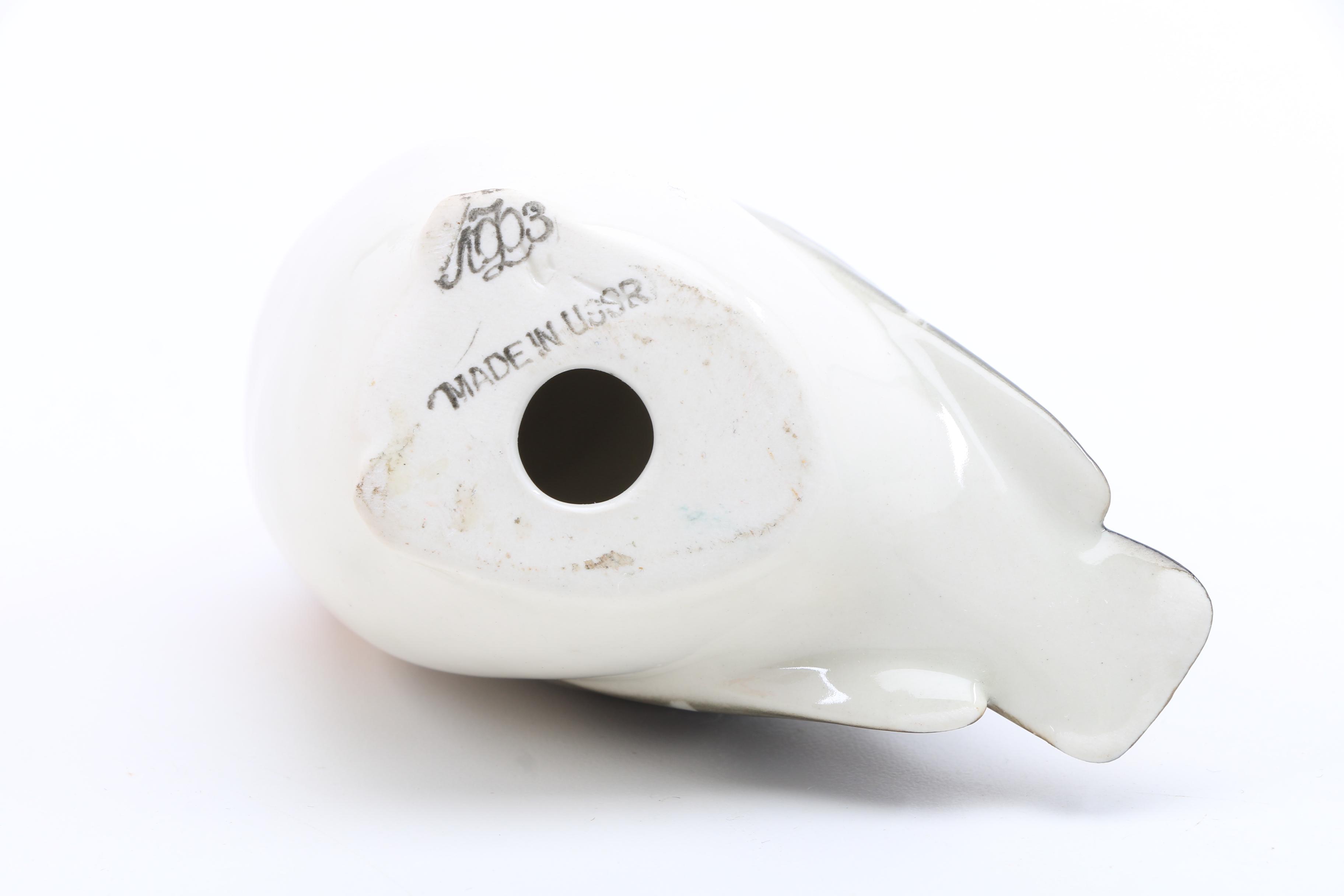 Assortment of Porcelain Figurines and a Vase