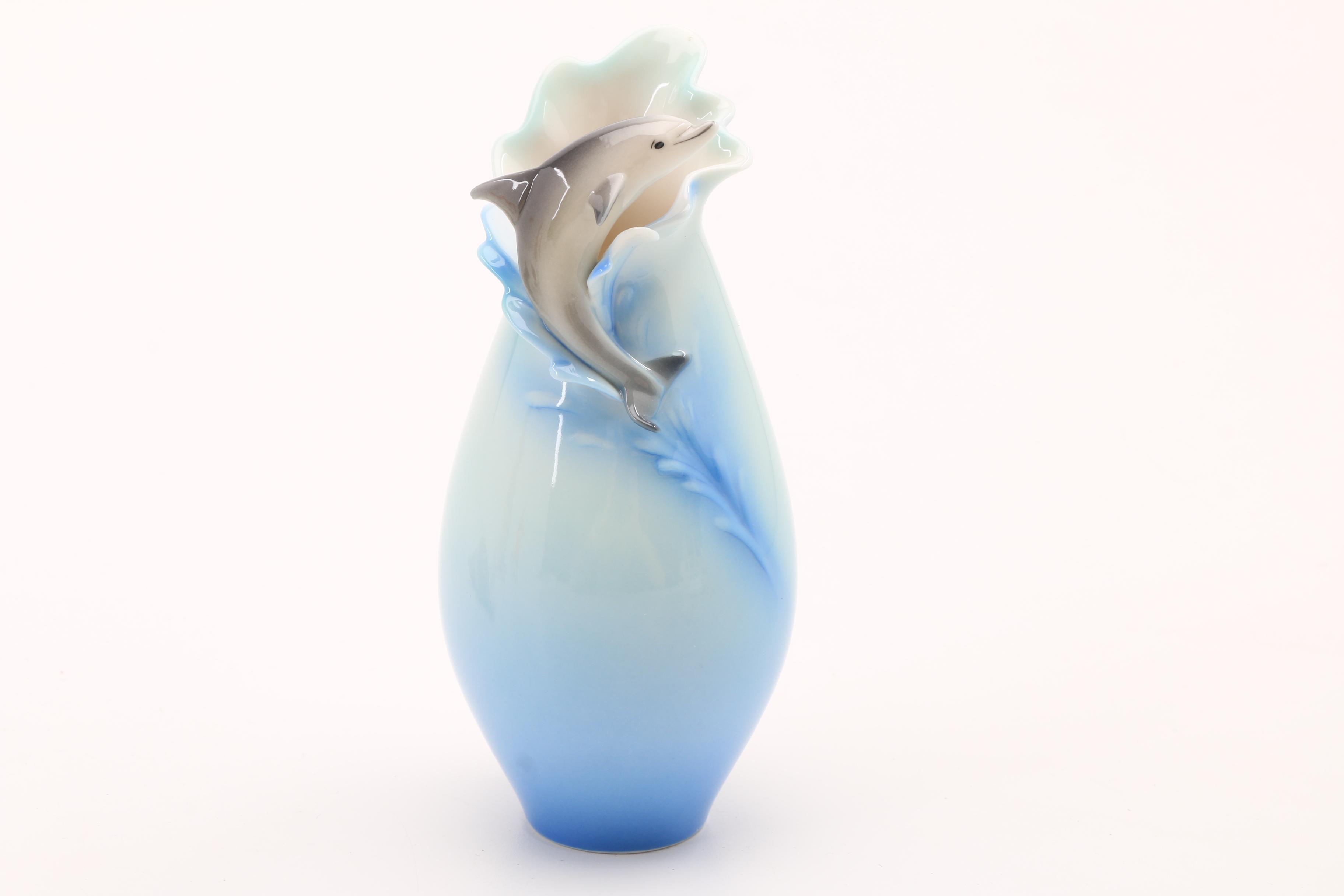 Assortment of Porcelain Figurines and a Vase