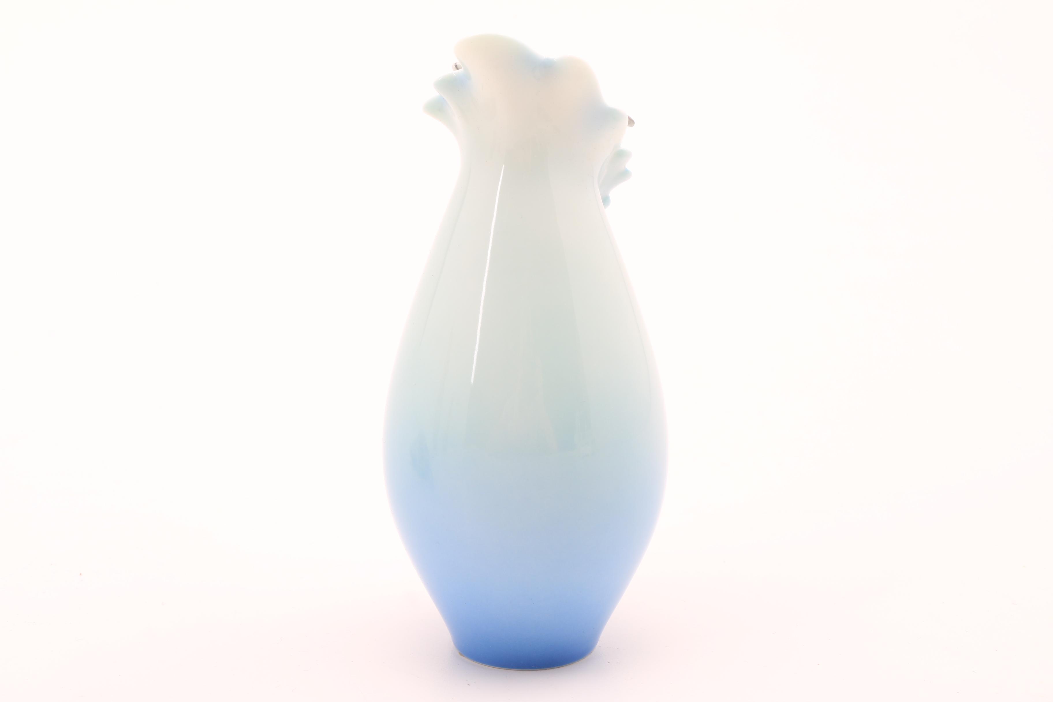 Assortment of Porcelain Figurines and a Vase