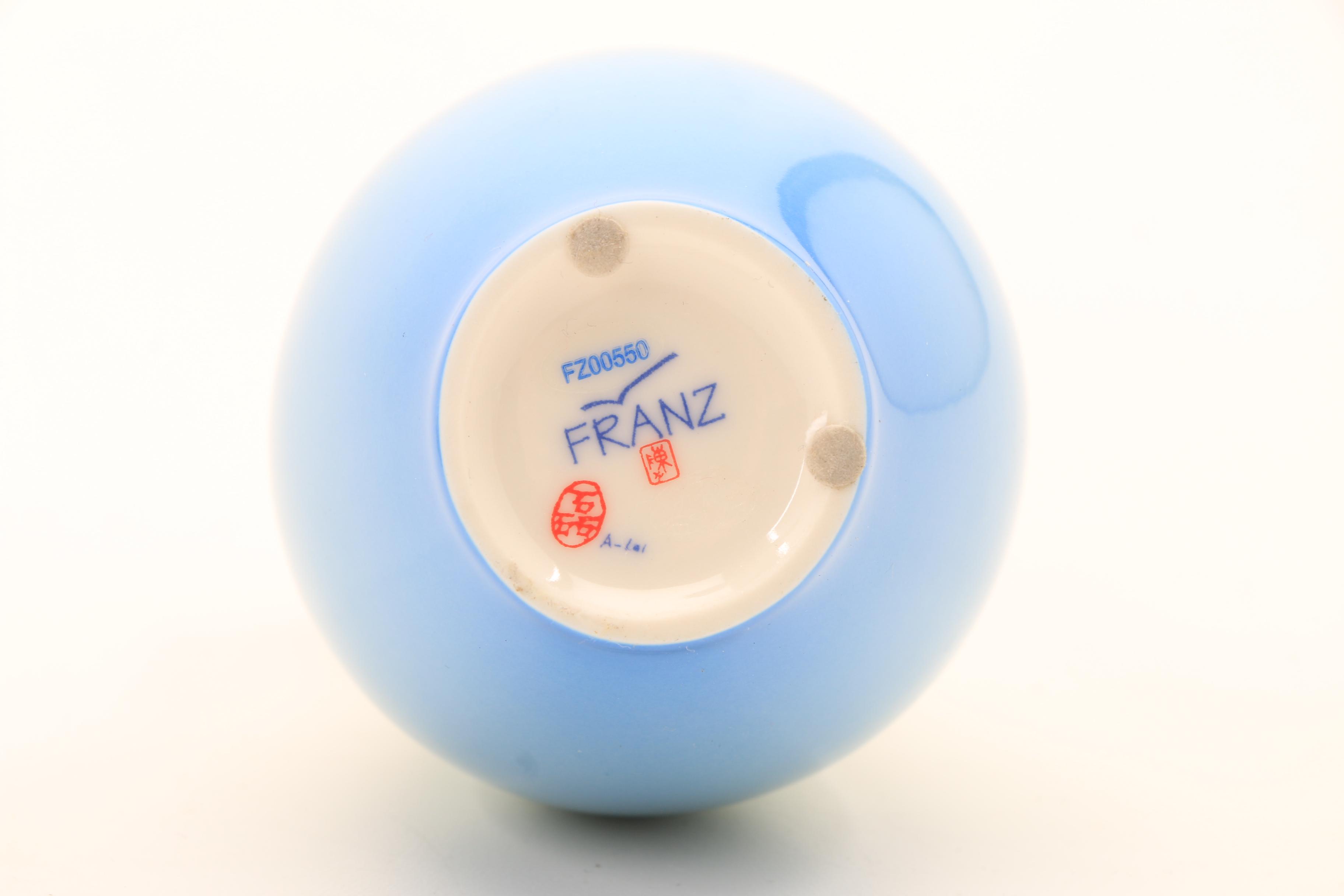 Assortment of Porcelain Figurines and a Vase