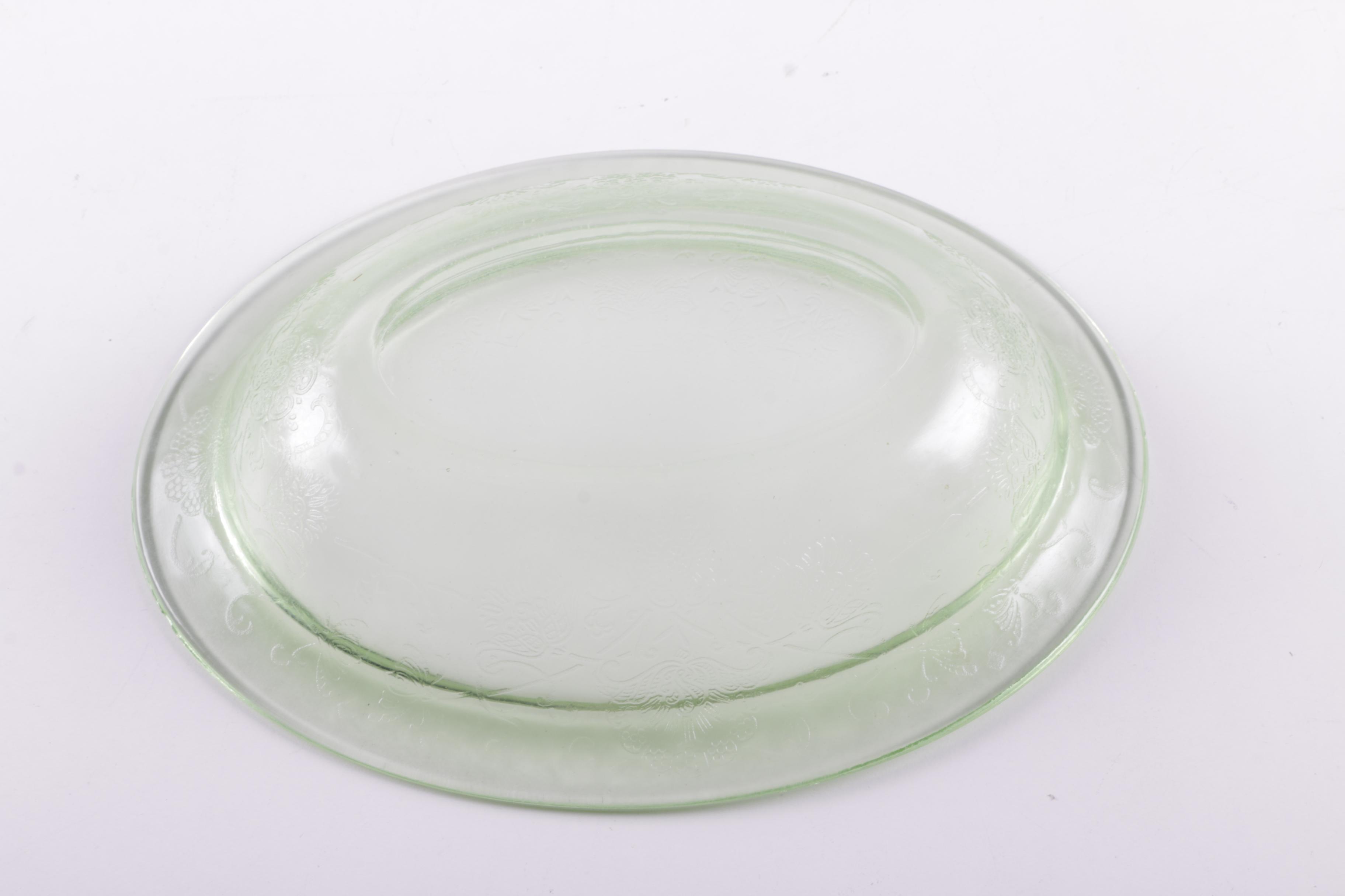 A Collection of Eight Pieces of Vaseline Glass Dishes