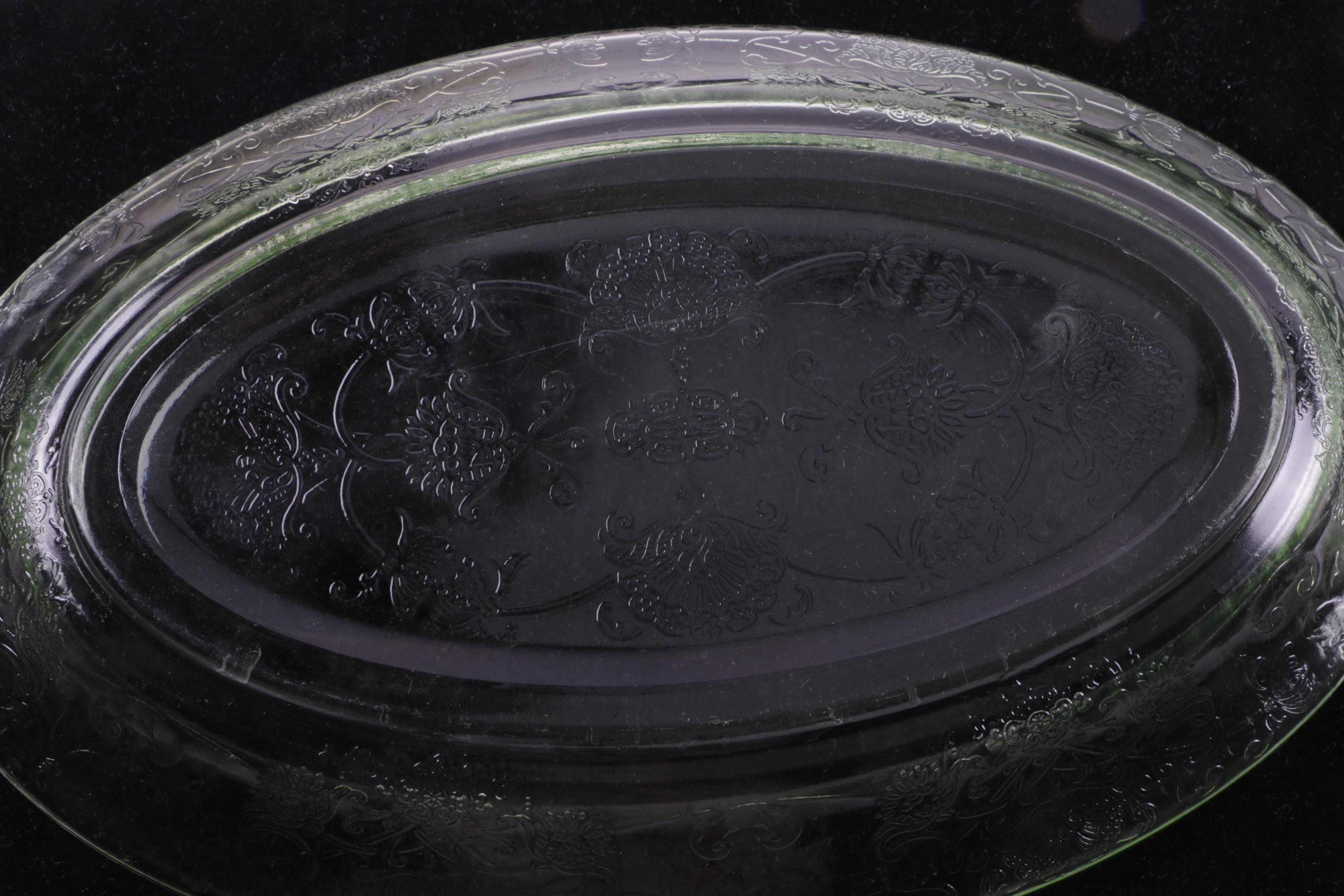 A Collection of Eight Pieces of Vaseline Glass Dishes