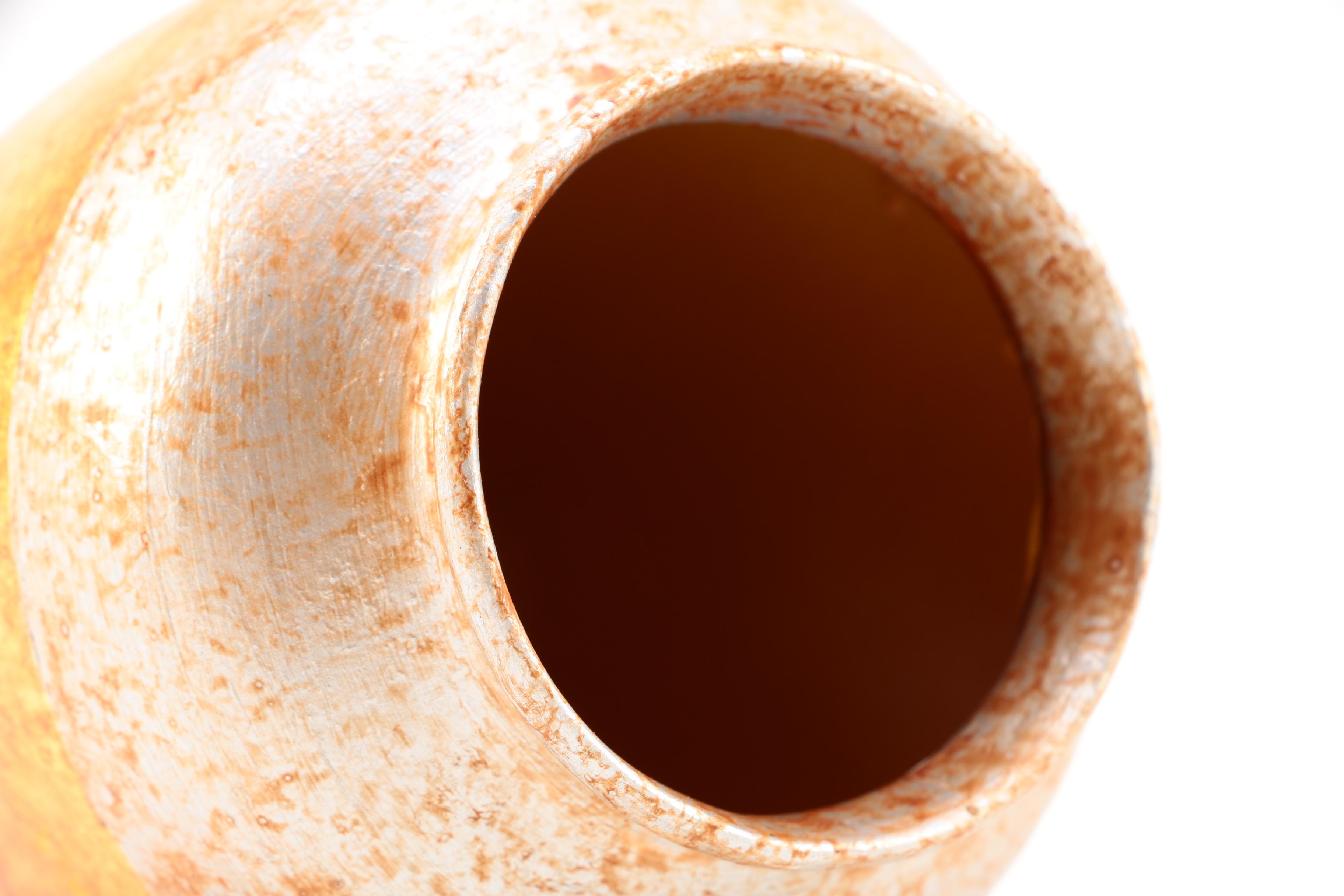 Pair of Gold and Silver Leaf Terra Cotta Vases