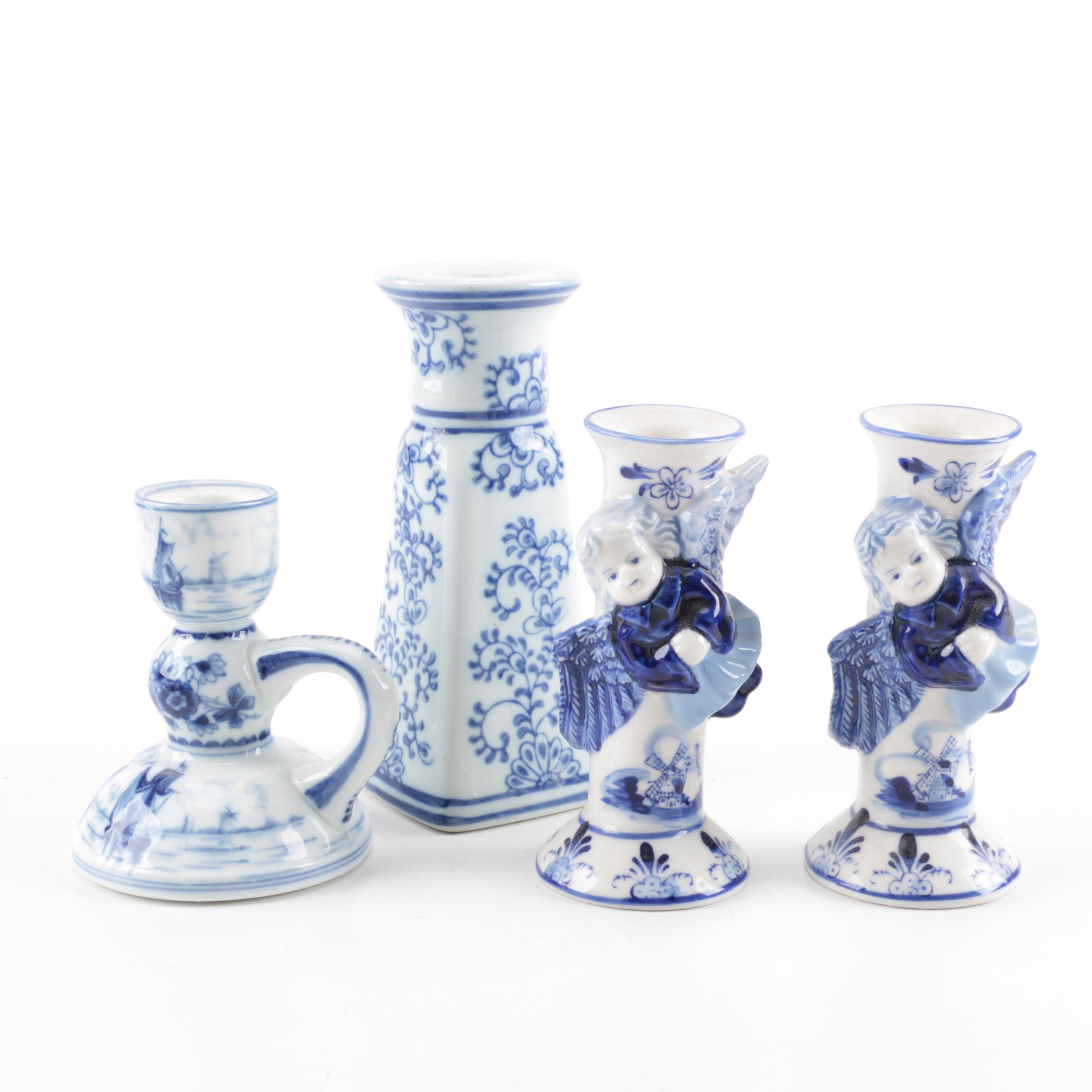 Four White and Blue Ceramic Candle Holders