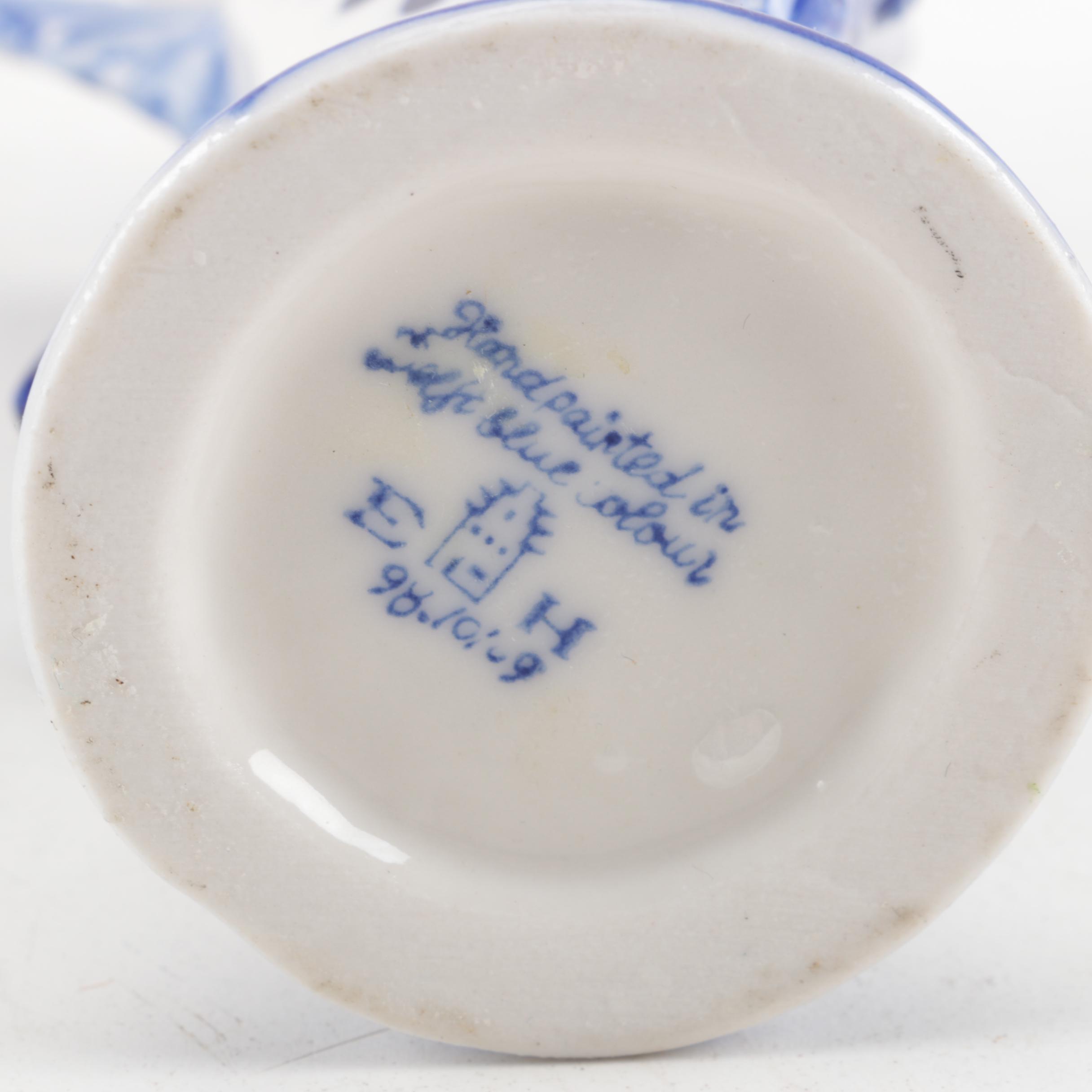 Four White and Blue Ceramic Candle Holders