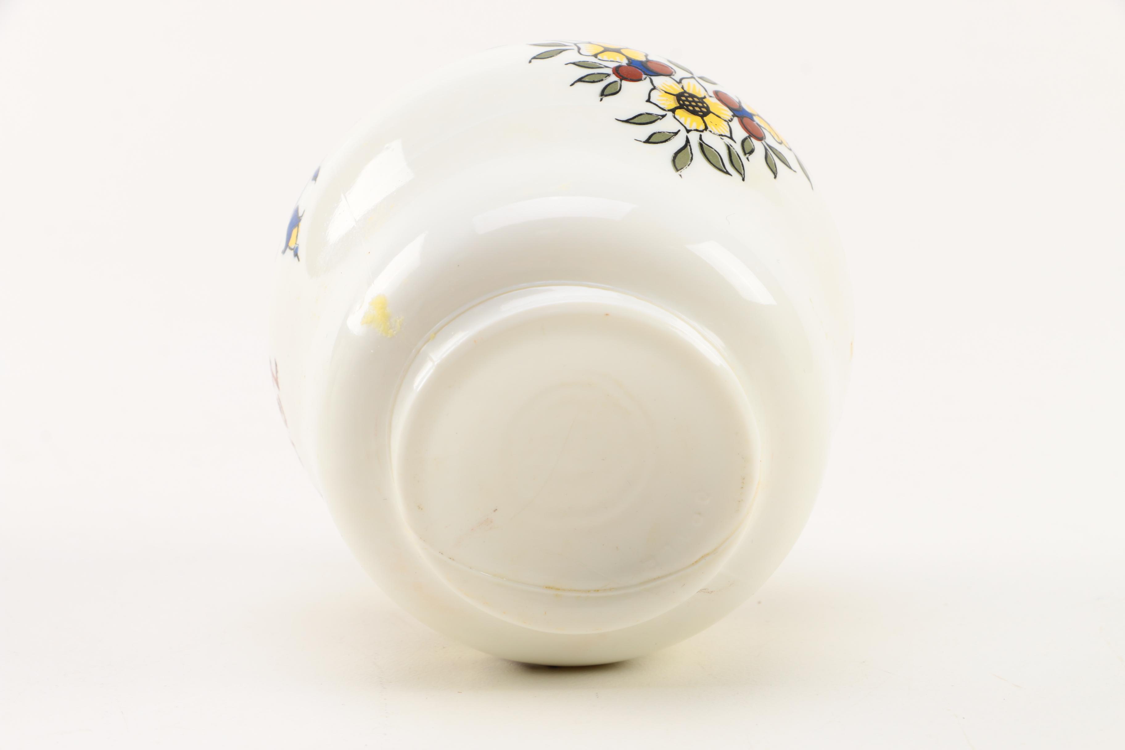 Four White Floral Ceramic Jars