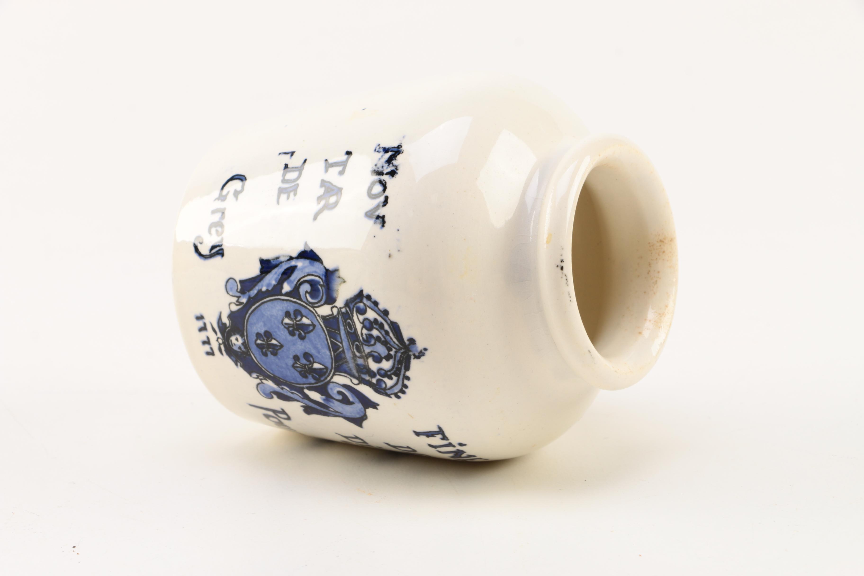 Four White Floral Ceramic Jars