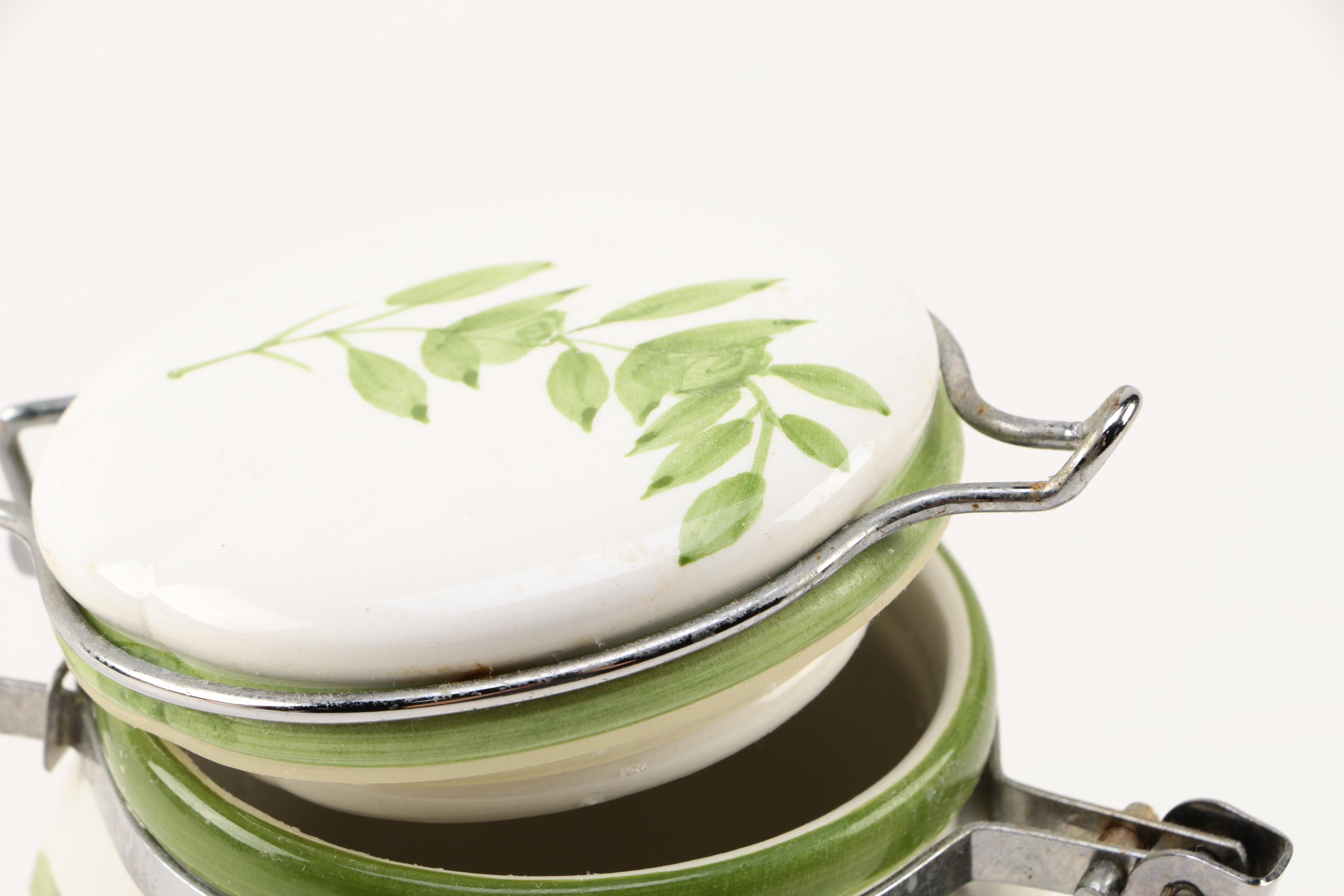 Four White Floral Ceramic Jars