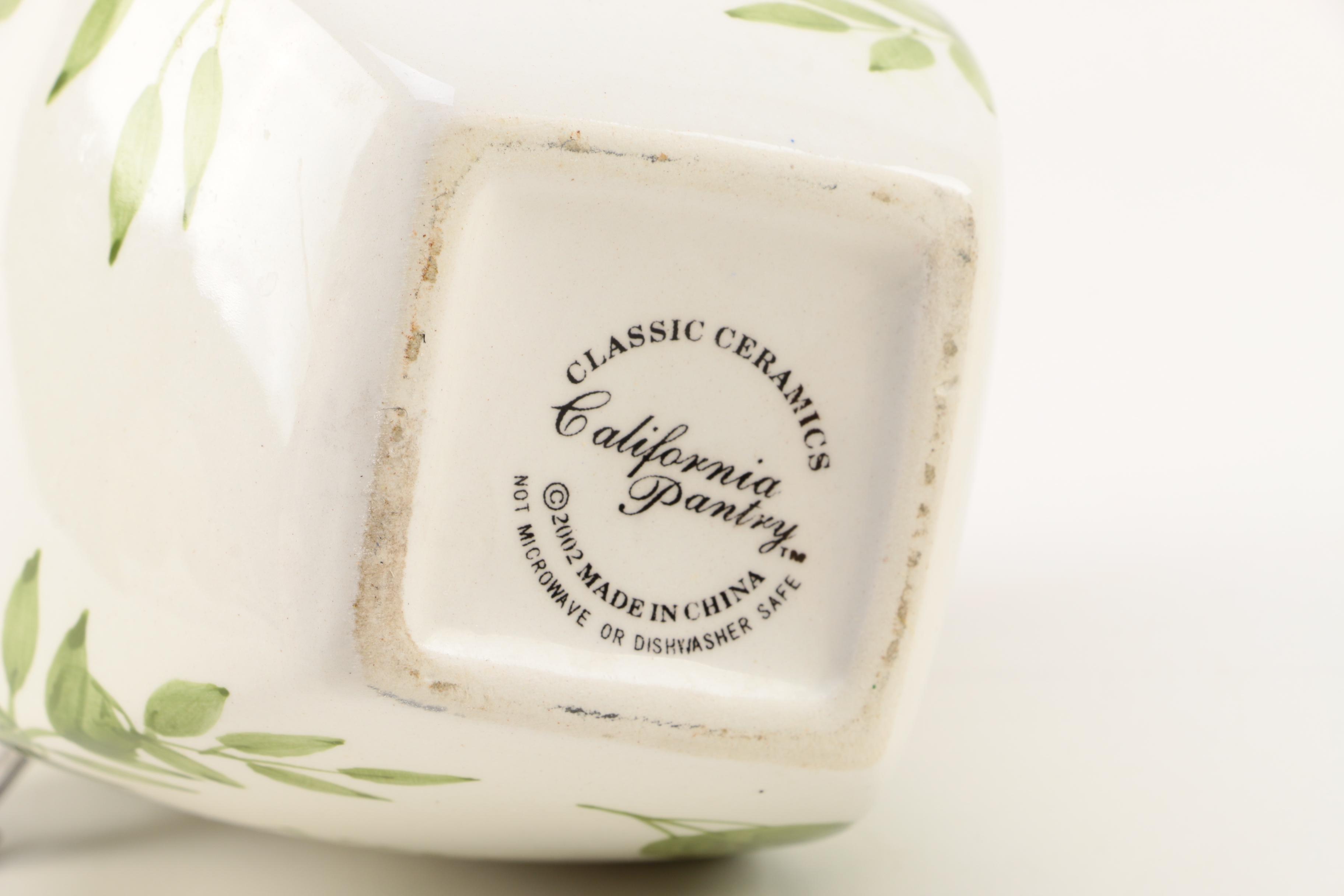 Four White Floral Ceramic Jars