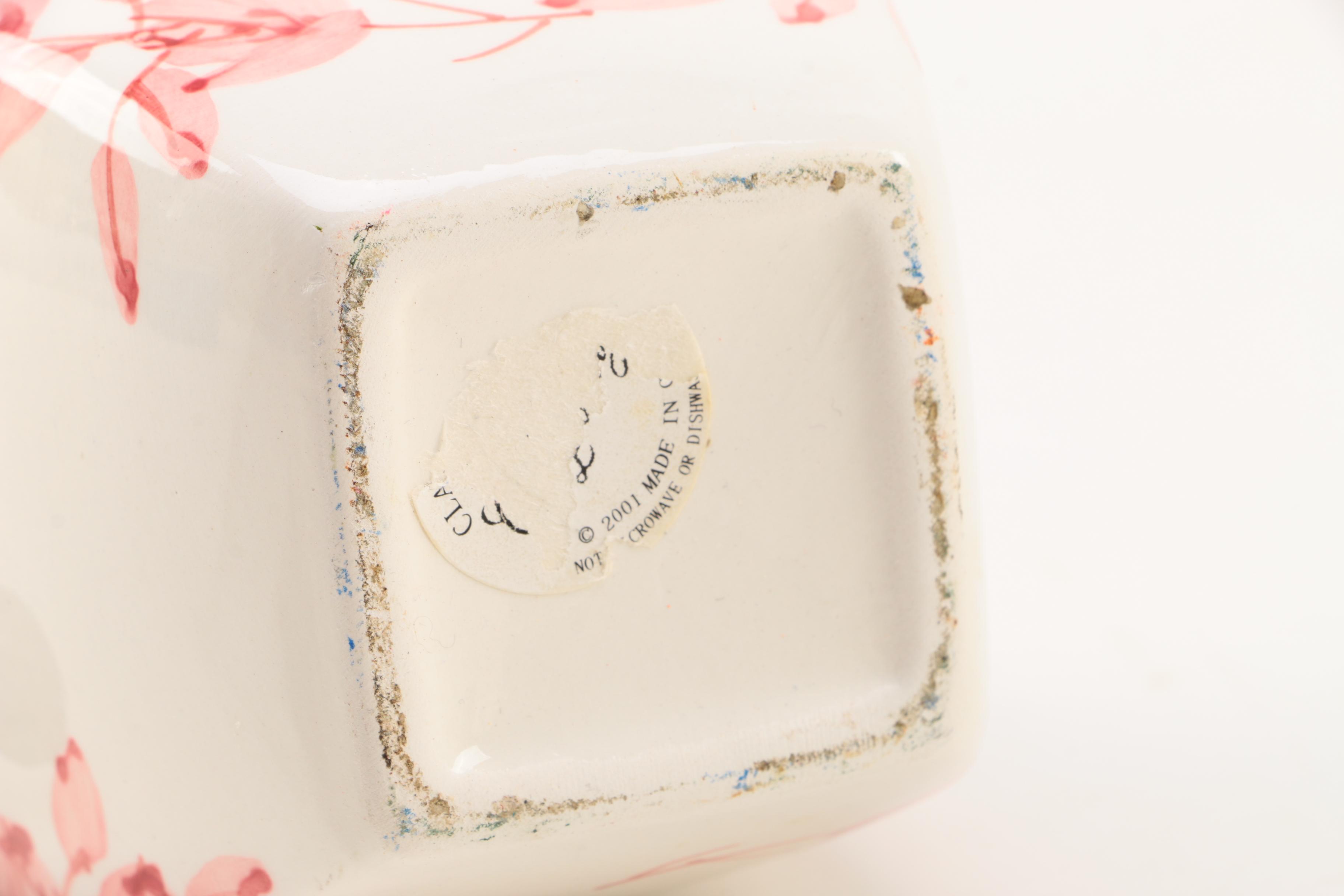 Four White Floral Ceramic Jars