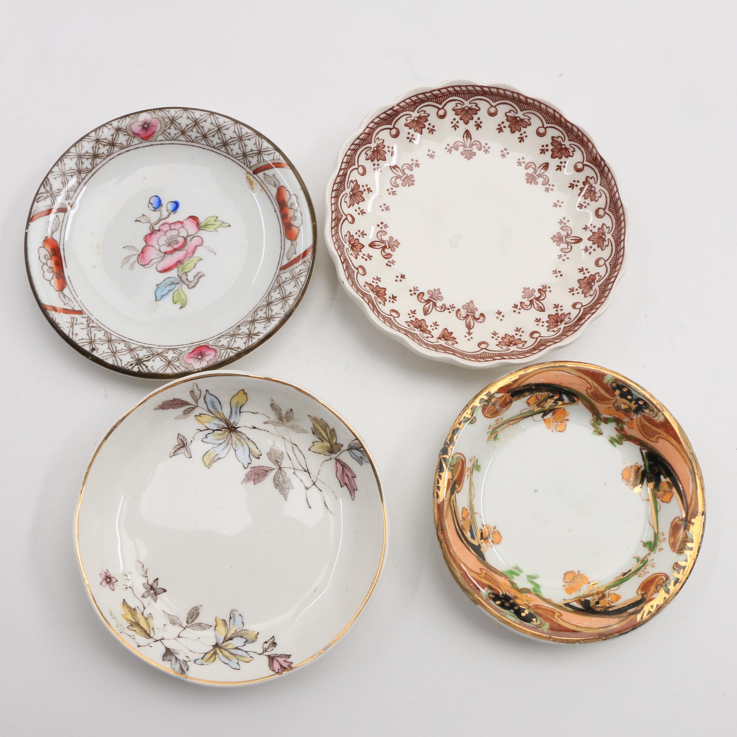 A Collection Of Over 140 Butter Pats