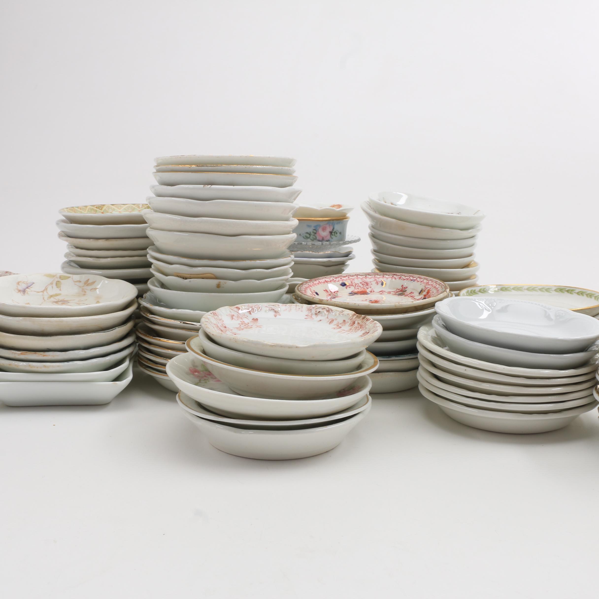 A Collection Of Over 140 Butter Pats