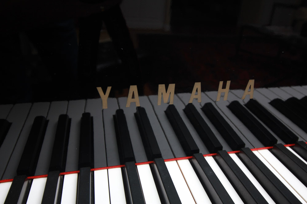 Black Yamaha Grand Piano and Bench