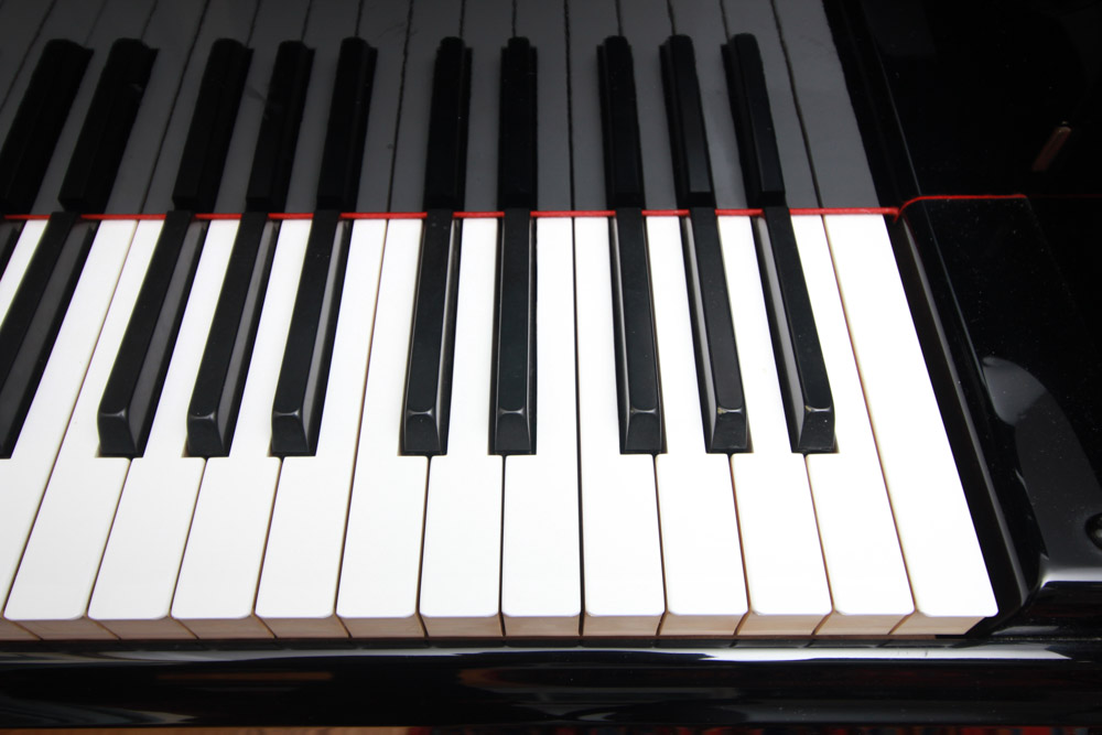 Black Yamaha Grand Piano and Bench