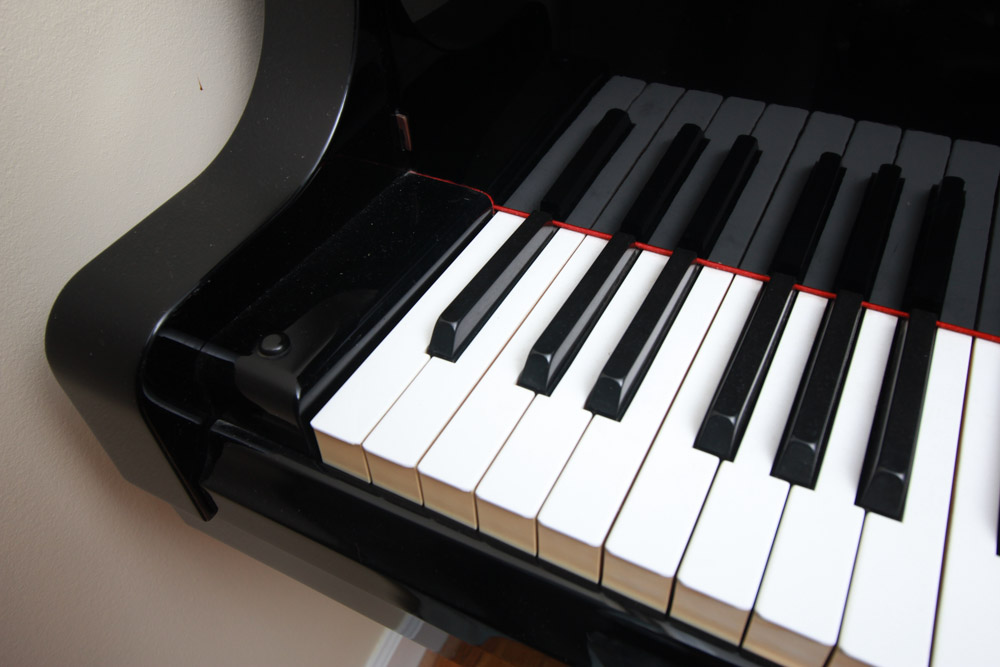 Black Yamaha Grand Piano and Bench