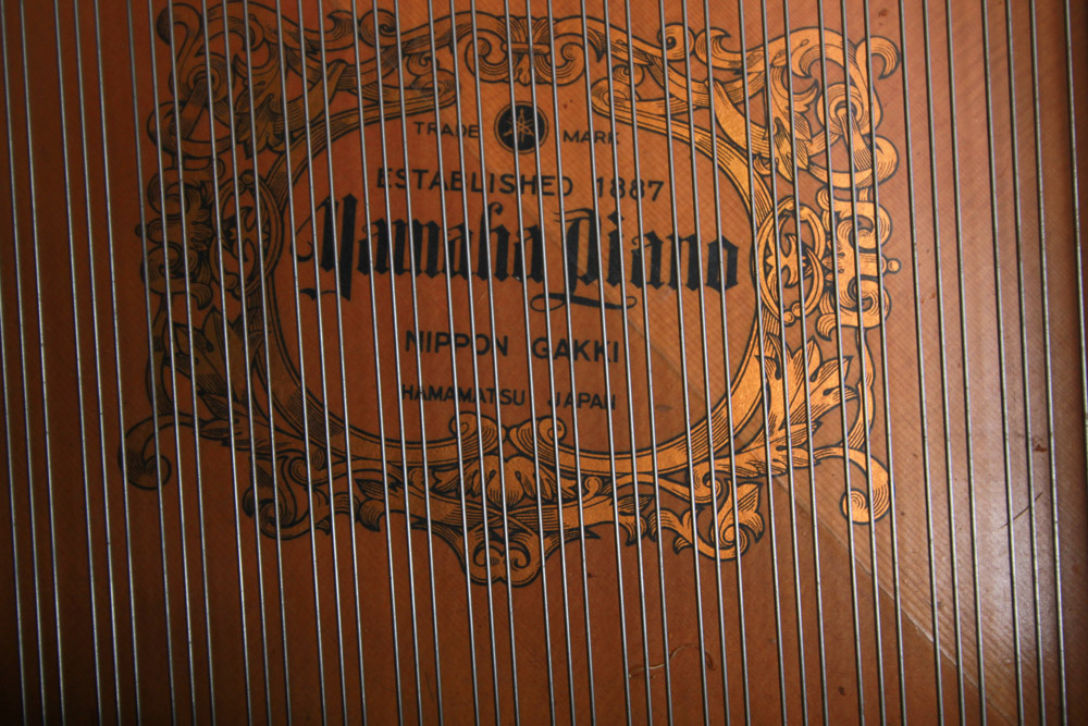 Black Yamaha Grand Piano and Bench