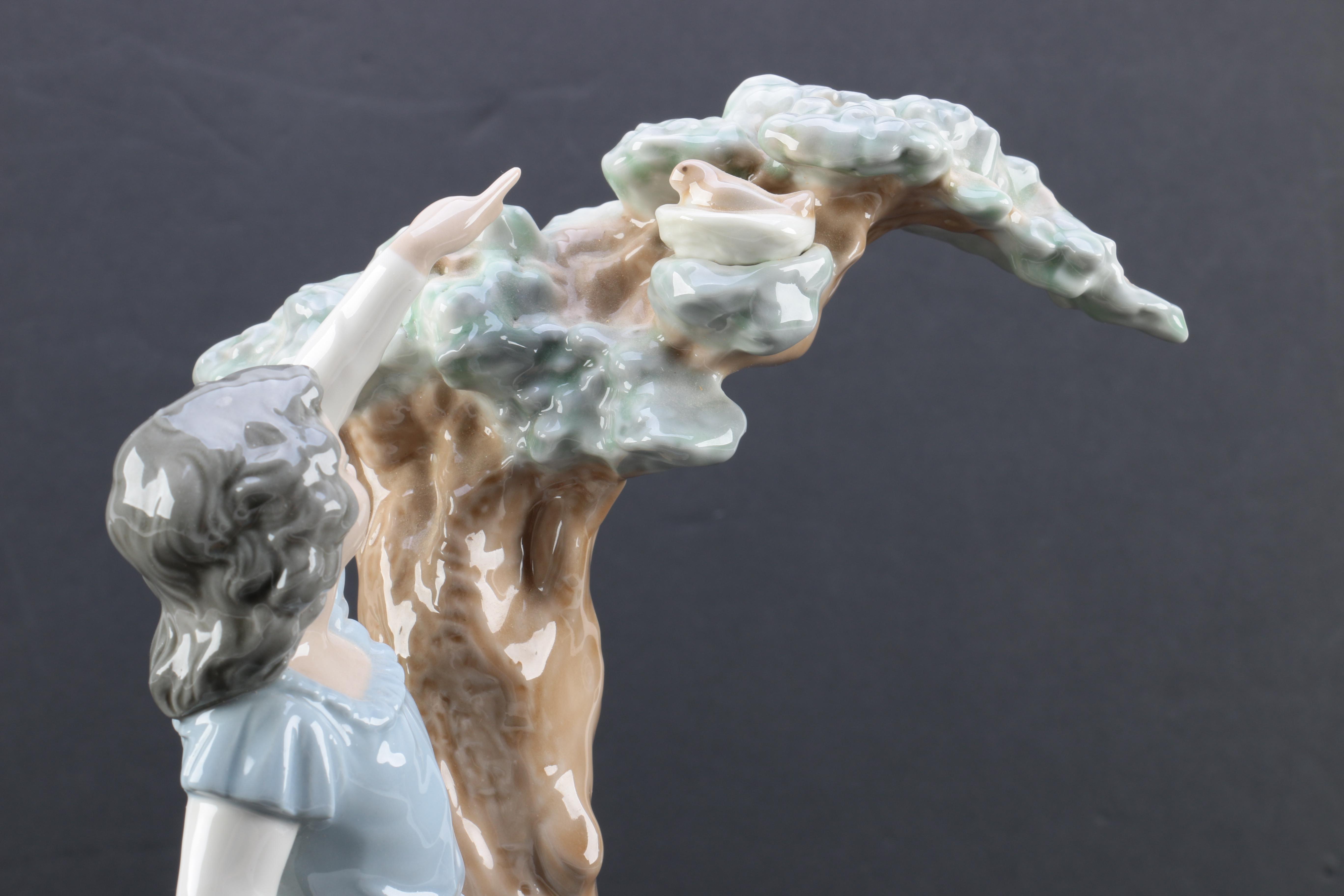 NAO by Lladró "Girl Pointing at Bird Nest" Porcelain Figurine