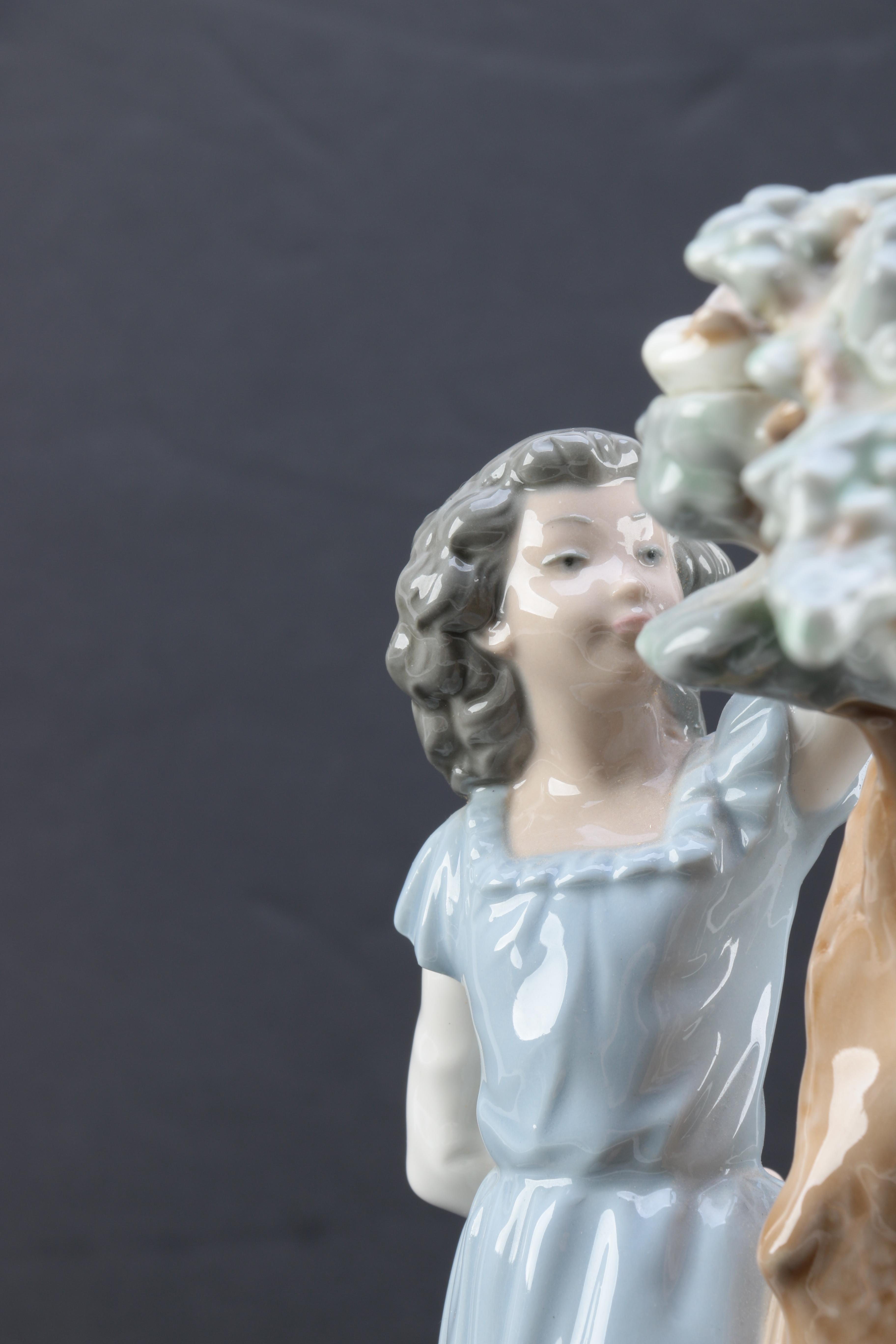 NAO by Lladró "Girl Pointing at Bird Nest" Porcelain Figurine