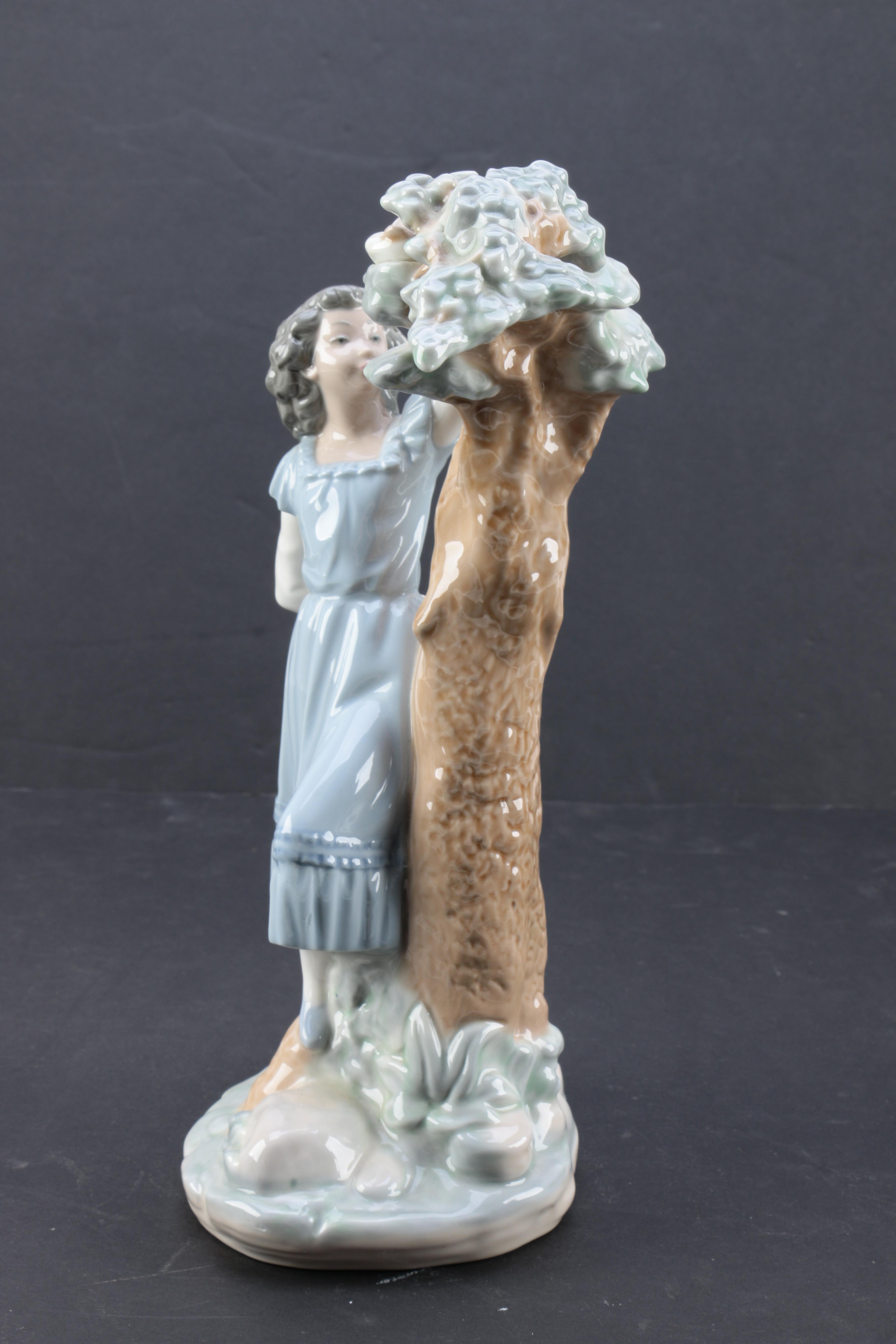 NAO by Lladró "Girl Pointing at Bird Nest" Porcelain Figurine
