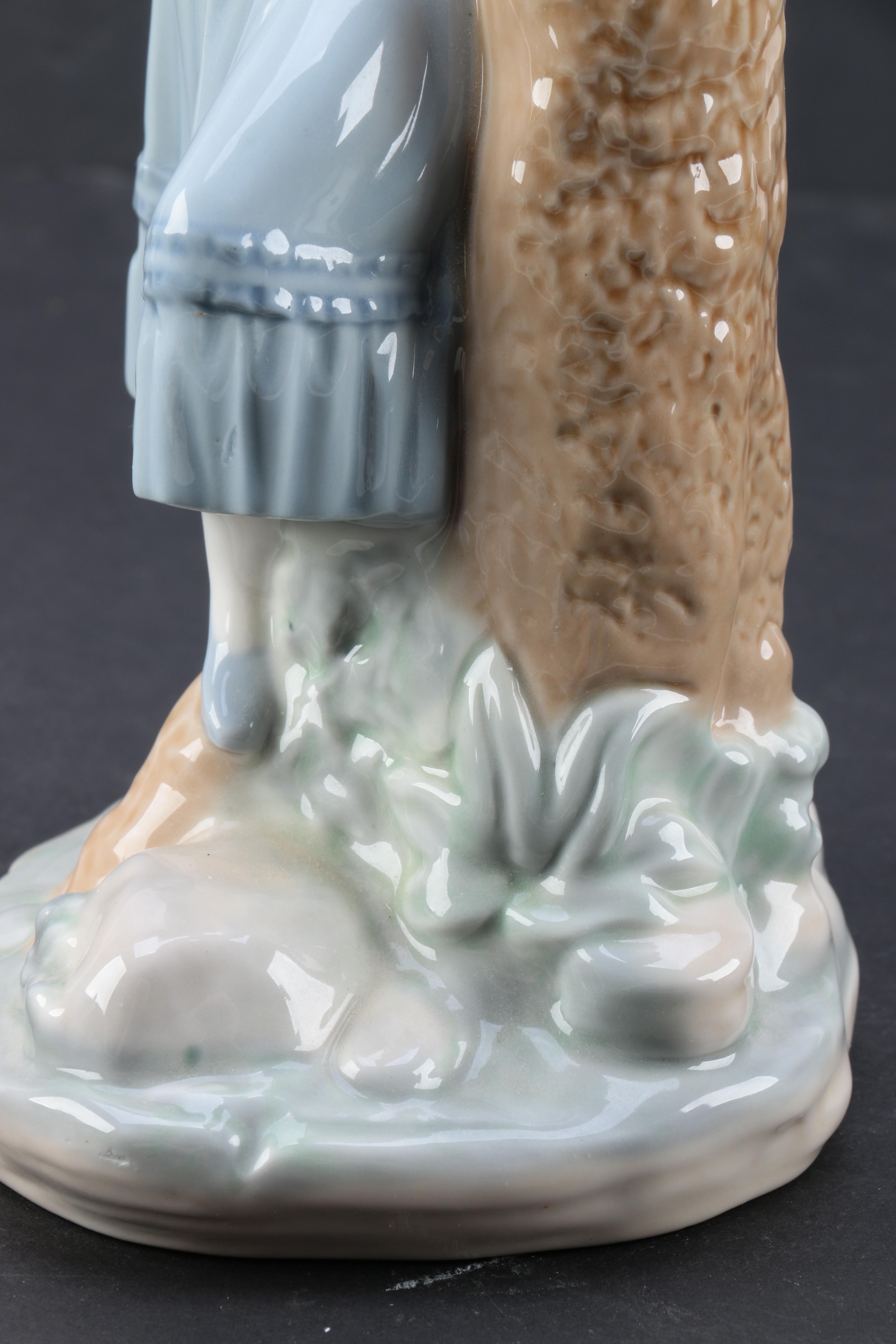 NAO by Lladró "Girl Pointing at Bird Nest" Porcelain Figurine