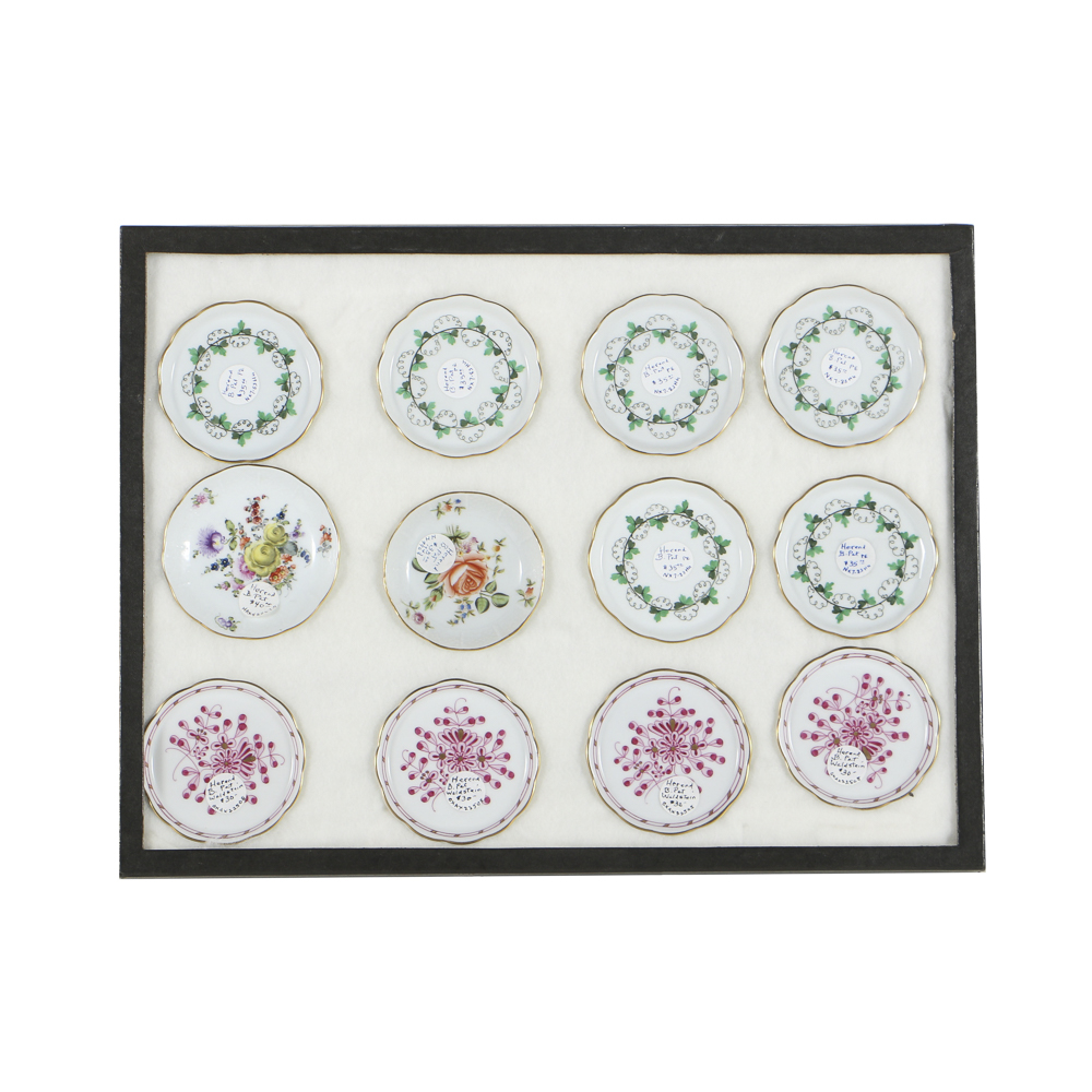 Twelve Herend Porcelain Butter Pats In Glass Top Display Case