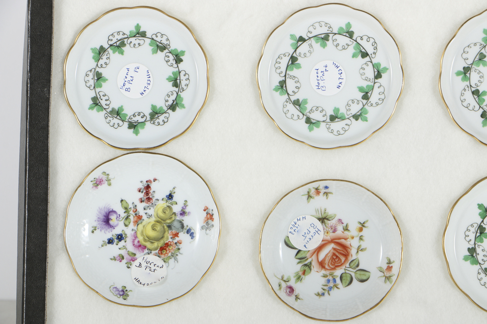 Twelve Herend Porcelain Butter Pats In Glass Top Display Case