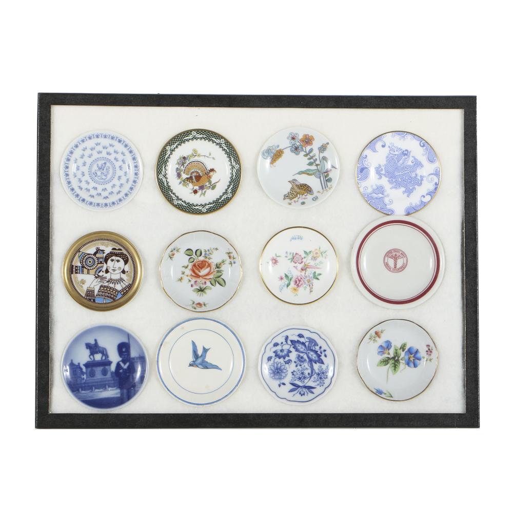 Twelve Porcelain Butter Pats In Glass Top Display Case