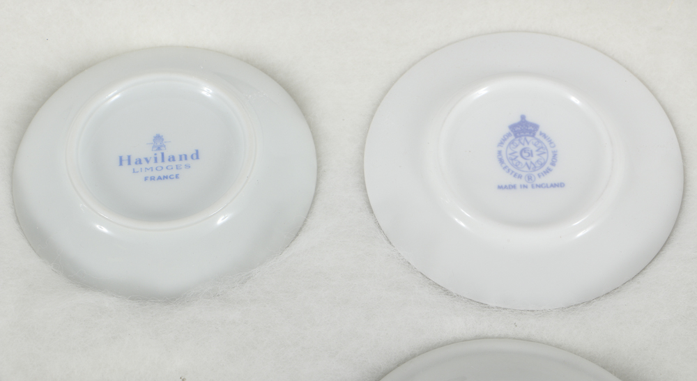 Twelve Porcelain Butter Pats In Glass Top Display Case